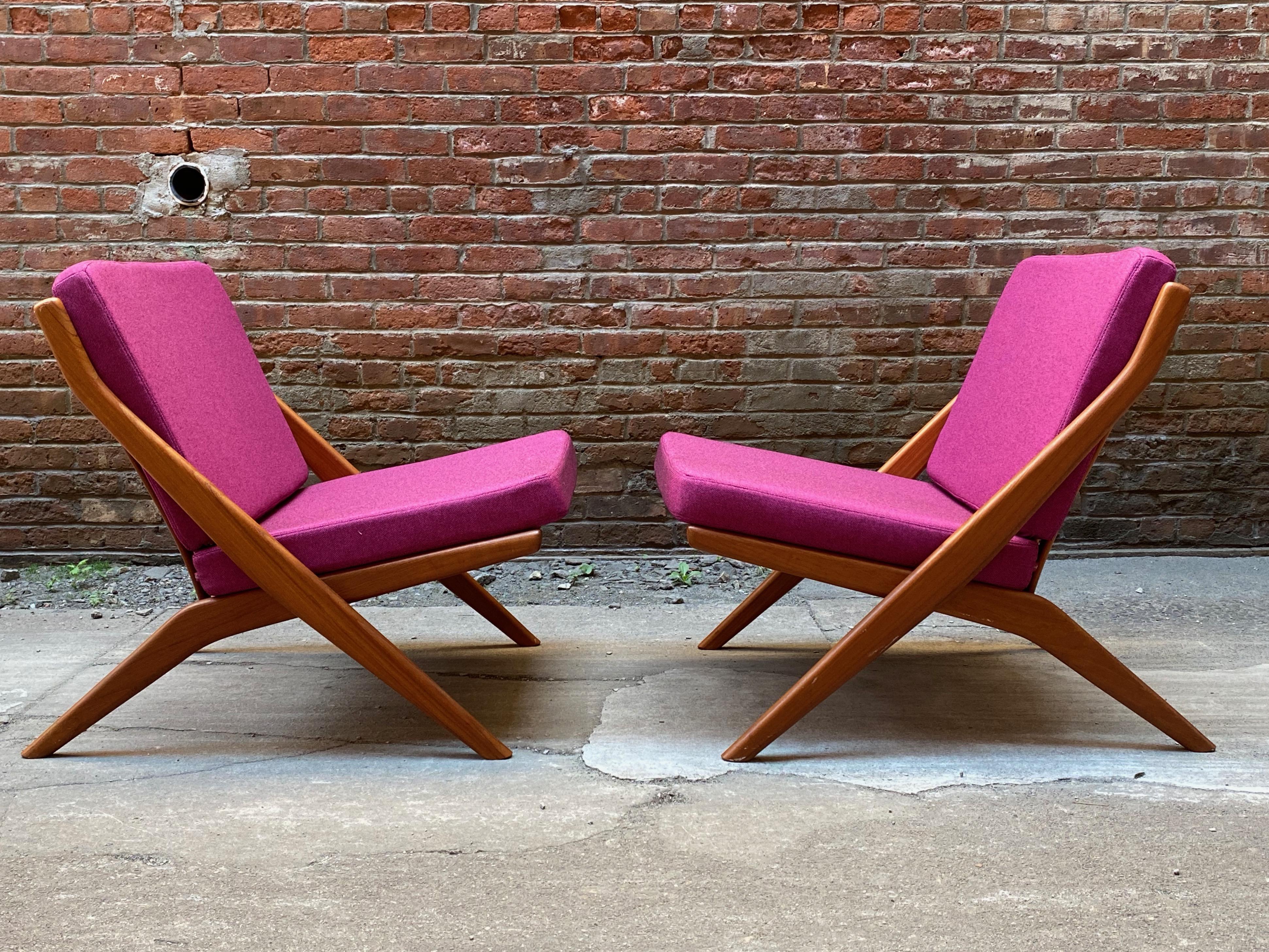 Pair of Folke Ohlsson designed scissor chairs for Dux of Sweden. Solid teak construction with very clean original oiled finish. Ergonomically slatted back contour and tapered legs. Freshly upholstered cushions with Knoll Hourglass Tart fabric and