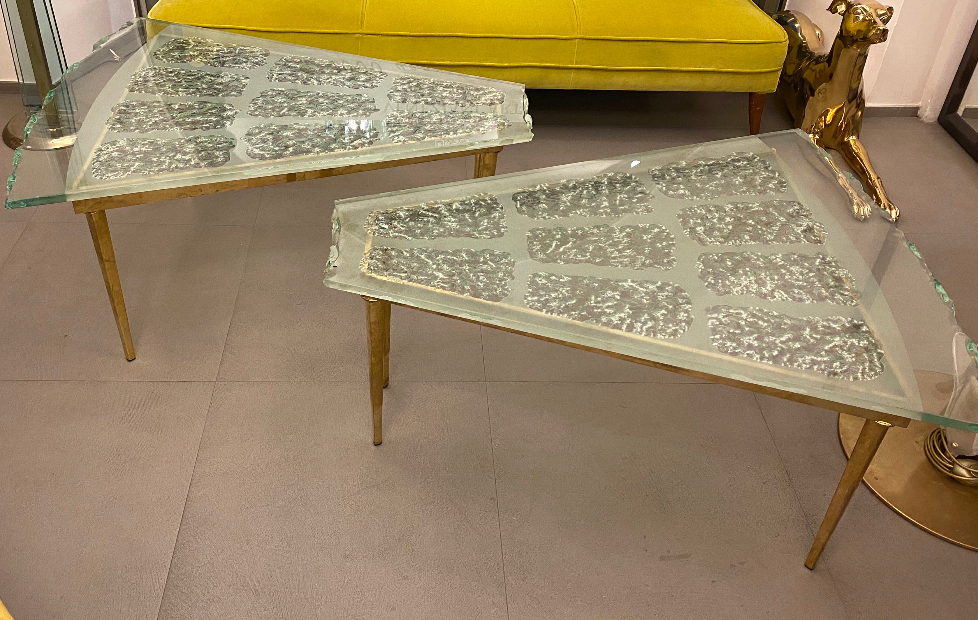 A Pair of   Rare Extraordinary  Mid-Century modern  Italian sofa table made of hand blown beveled and frosted Murano glass, designed by Max Ingrand and produced by Fontana Arte.   The detailed etched coffee table is supported by a brass frame,