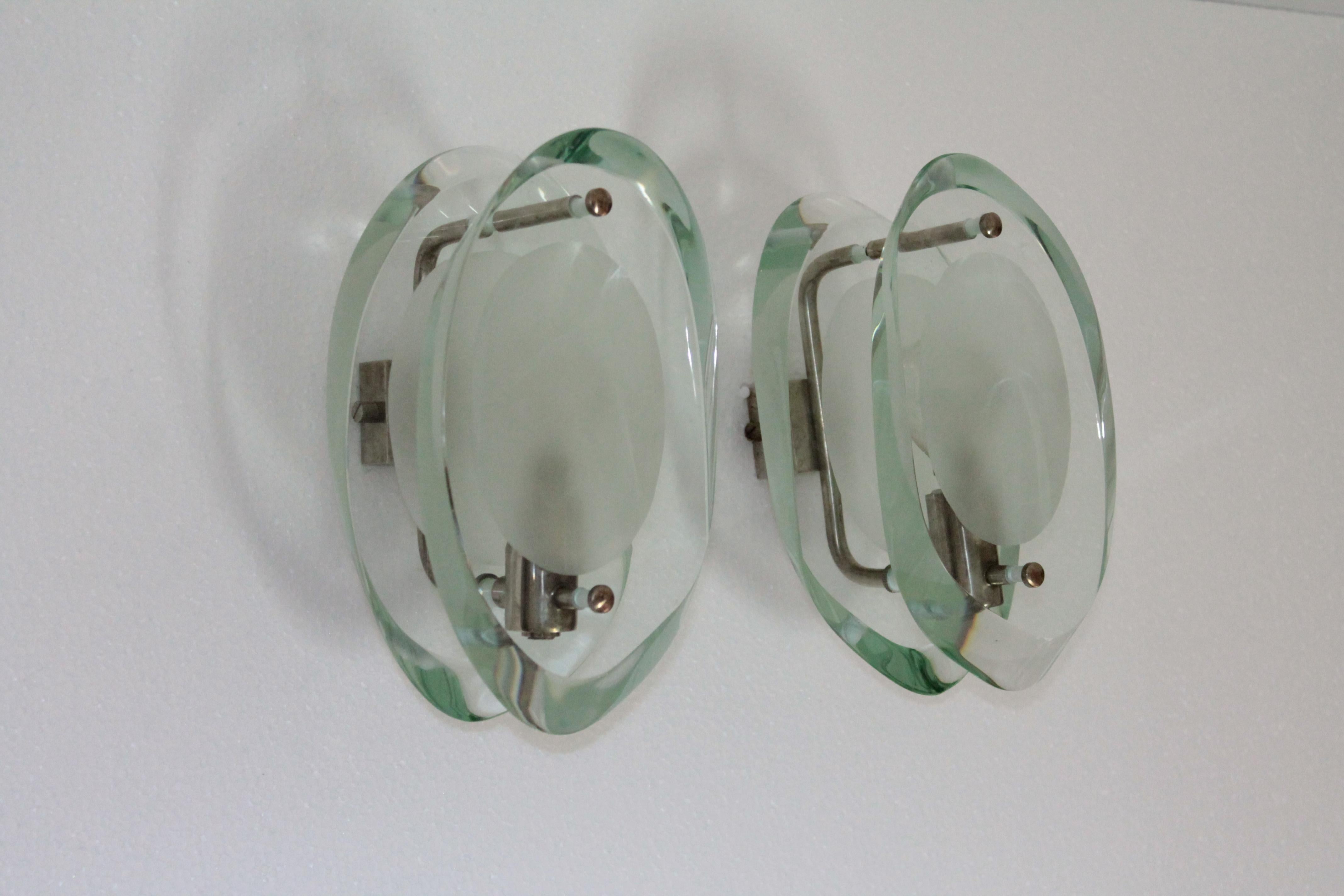 Pair of sconces designed by Max Ingrand and produced by Fontana Arte during the 1960s.