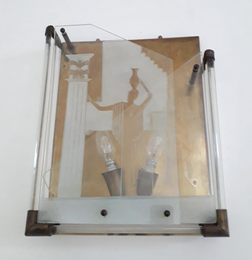 Original vintage Italian wall lights with brass hardware and sand blasted glass graving / Made in Italy by Fontana Arte designed by Gio' Ponti, circa 1935
Measures: height 16 inches, width 13.5 inches, depth 3.5 inches
2 lights / E12 or E14 type /