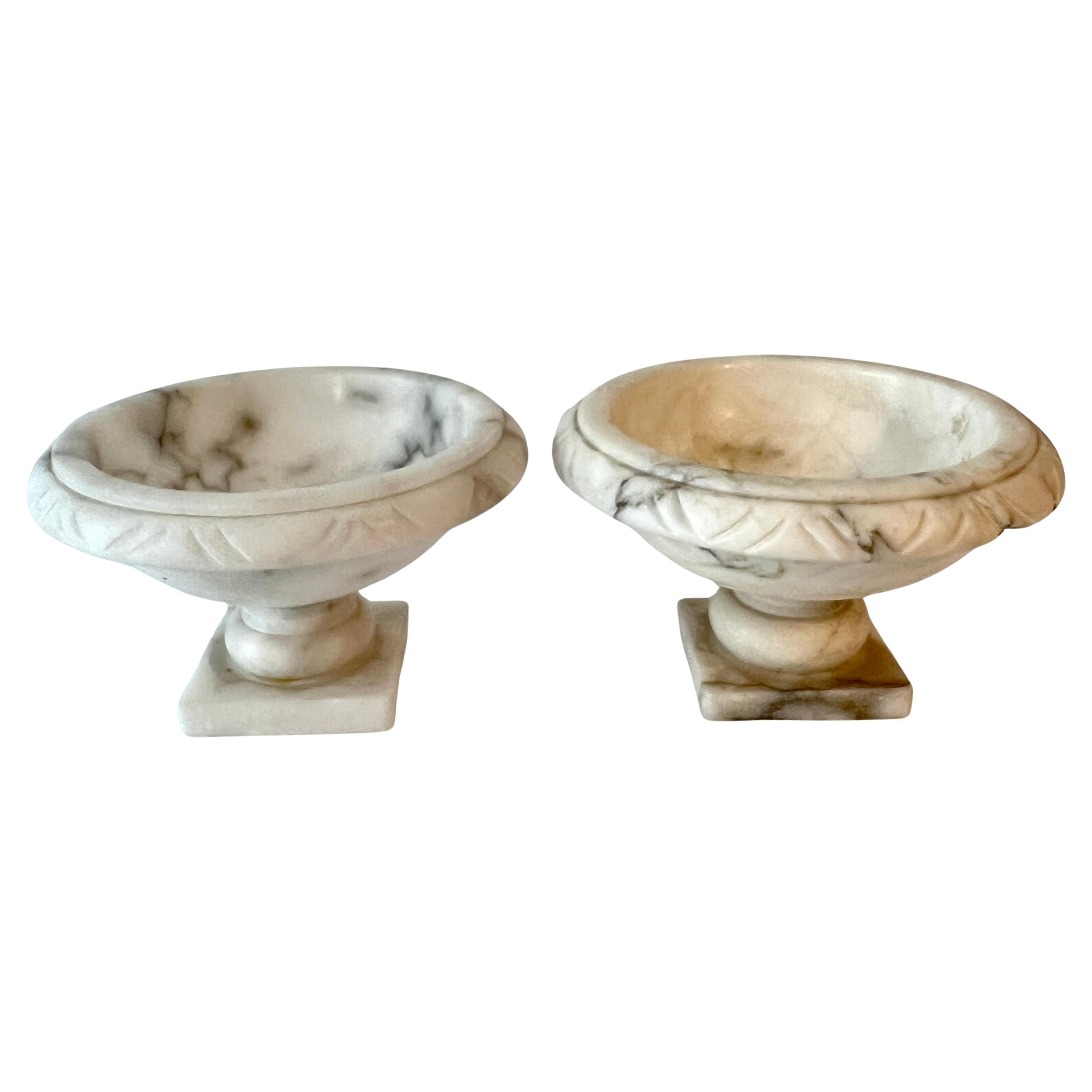 Pair of Hand Crafted Alabaster footed bowls.  The pair are a delightful couple that would be a compliment to the bar for condiments, the cocktail table for nuts or candy, the kitchen island to hold spices or garlic and also for the office on a desk