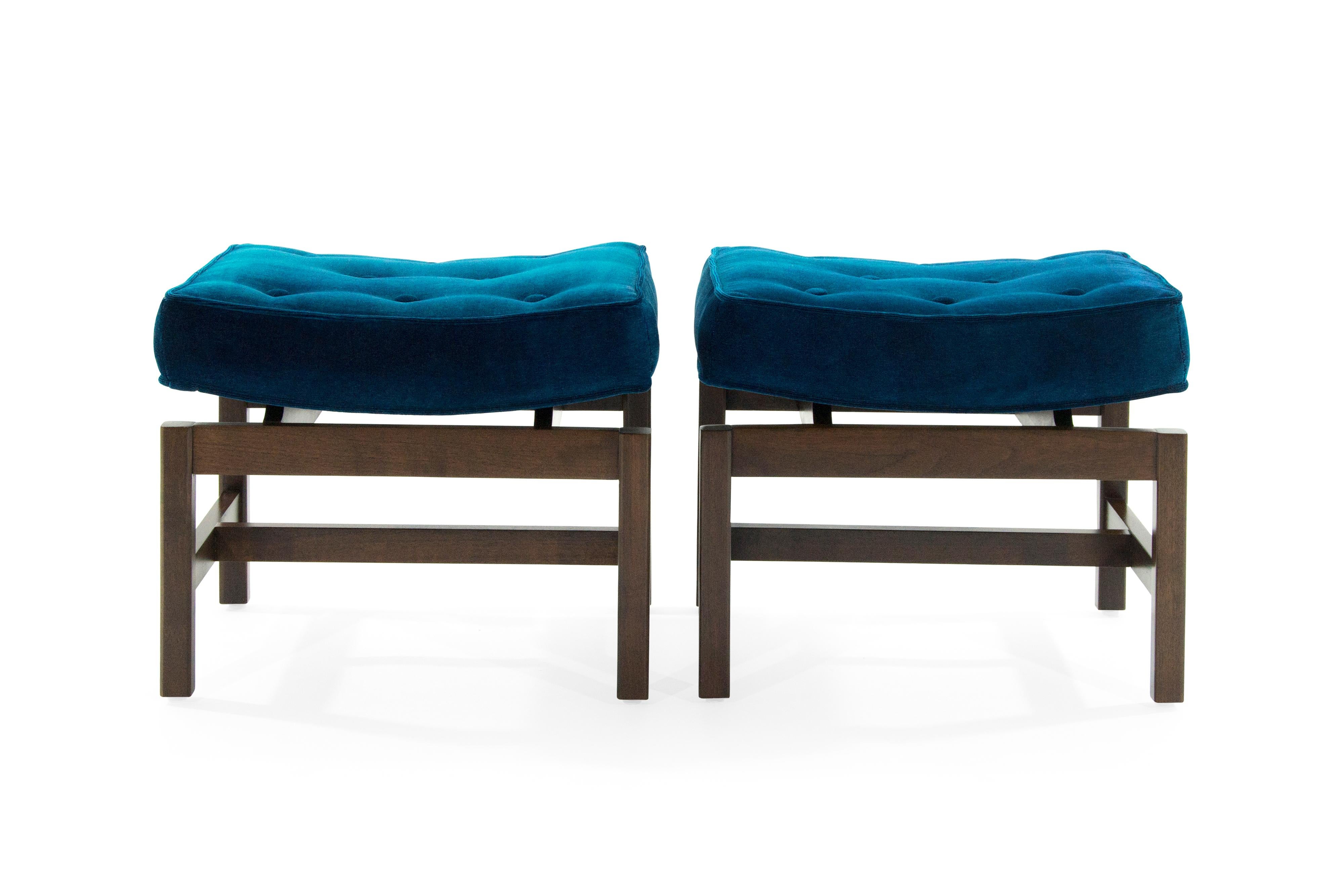 Set of footstools or benches designed by Jens Risom, circa 1950s.

Walnut bases fully restored, newly upholstered in aqua velvet by Holly Hunt.