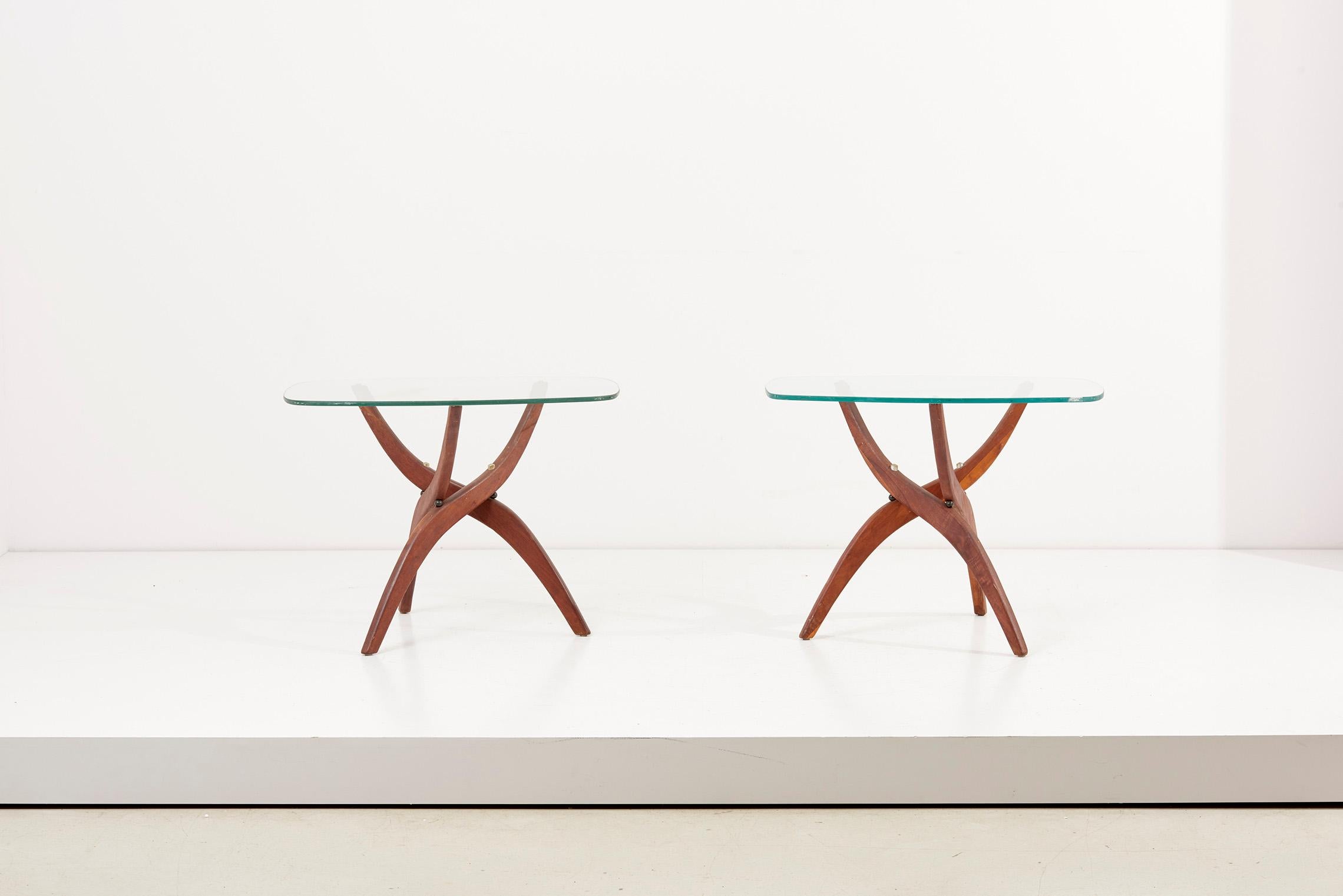 Pair of Forest Wilson side tables, USA 1960s 
Elegant set of 2 sculpted walnut tables by Forest Wilson with rectangular glass top and slightly rounded edges.