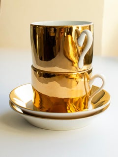 Pair of Fornasetti Porcelain Cups and Saucers with Gilt Interiors, Italy