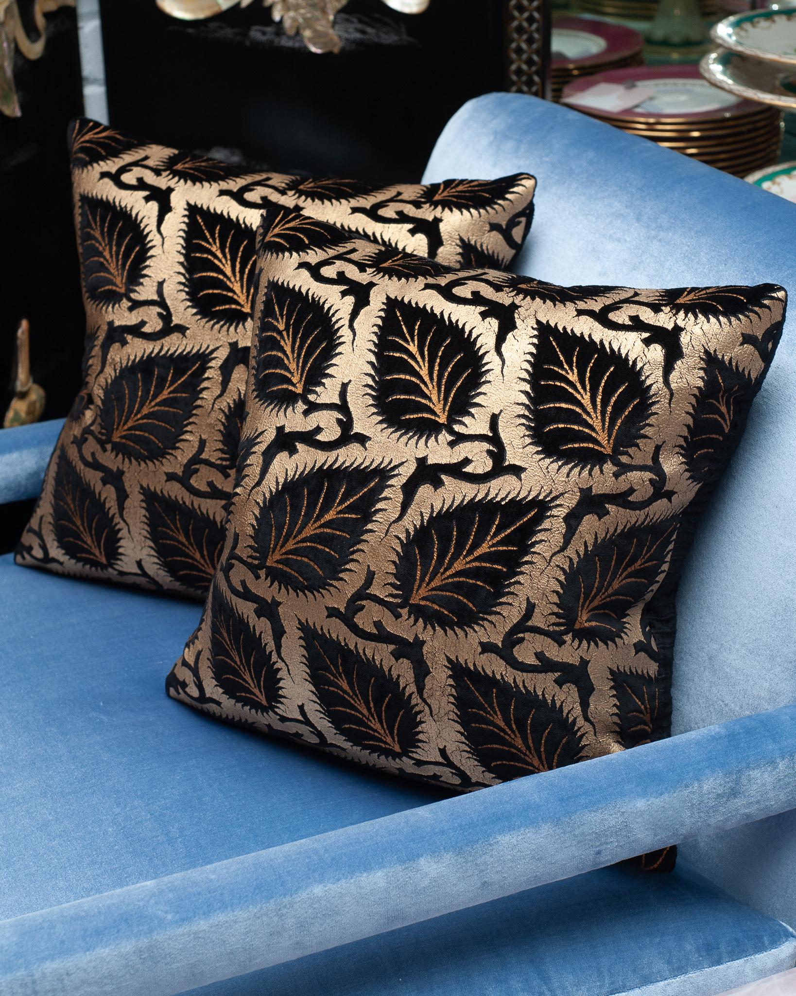 A pair of dramatic Fortuny black and gold silk velvet pillows. Filled with Canadian goose down and feather. Made in Venice.

Mario Fortuny was born in 1871 in Granada Spain and after a childhood marked by the premature death of his father he moved