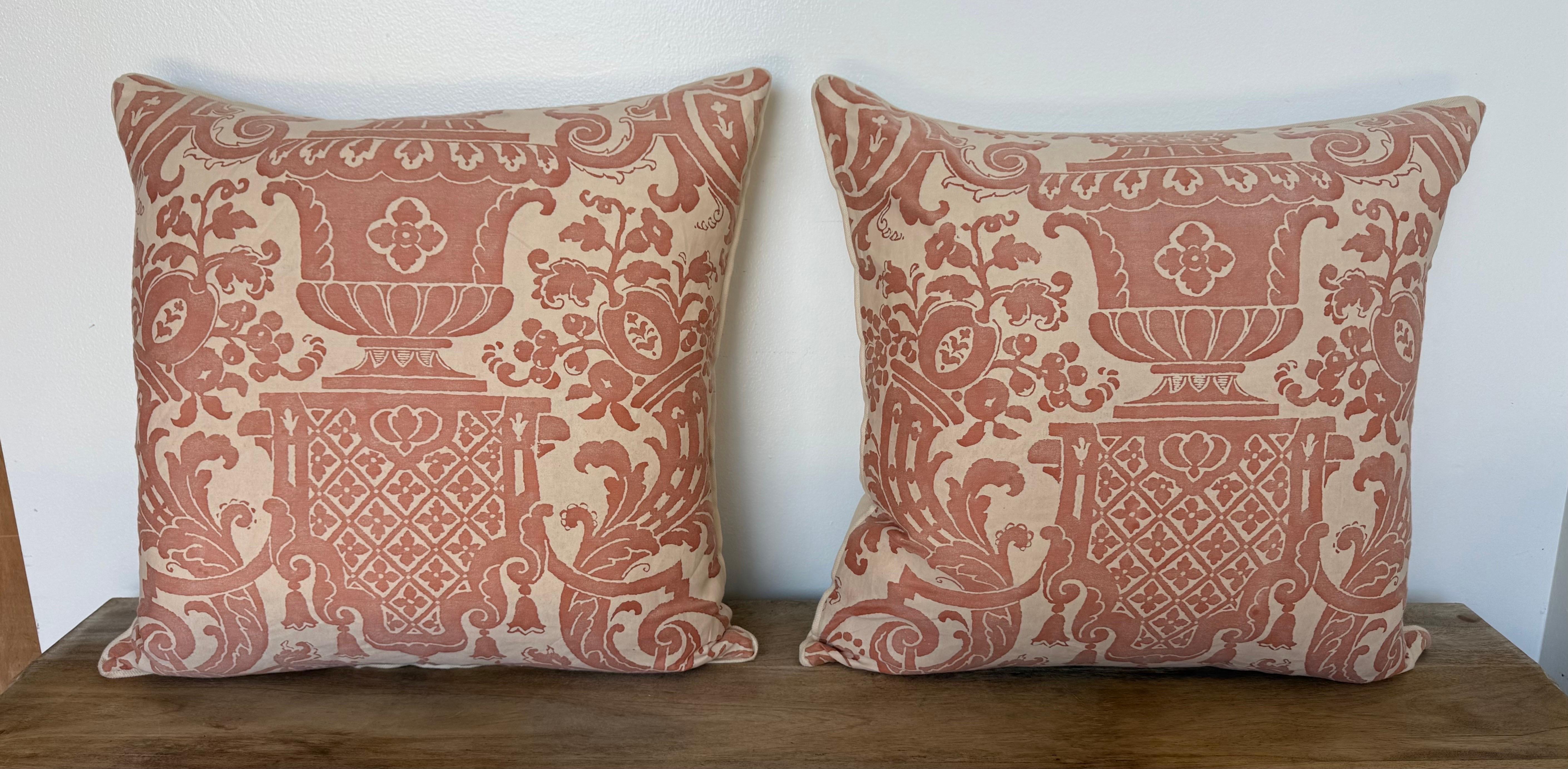 A resplendent pair of custom-made pillows by Melissa Levinson, featuring the iconic Fortuny “Carnavalet” textile. The front displays a grand damask composition of garden urns, floral opulence, and refined scrollwork—meticulously hand-printed in