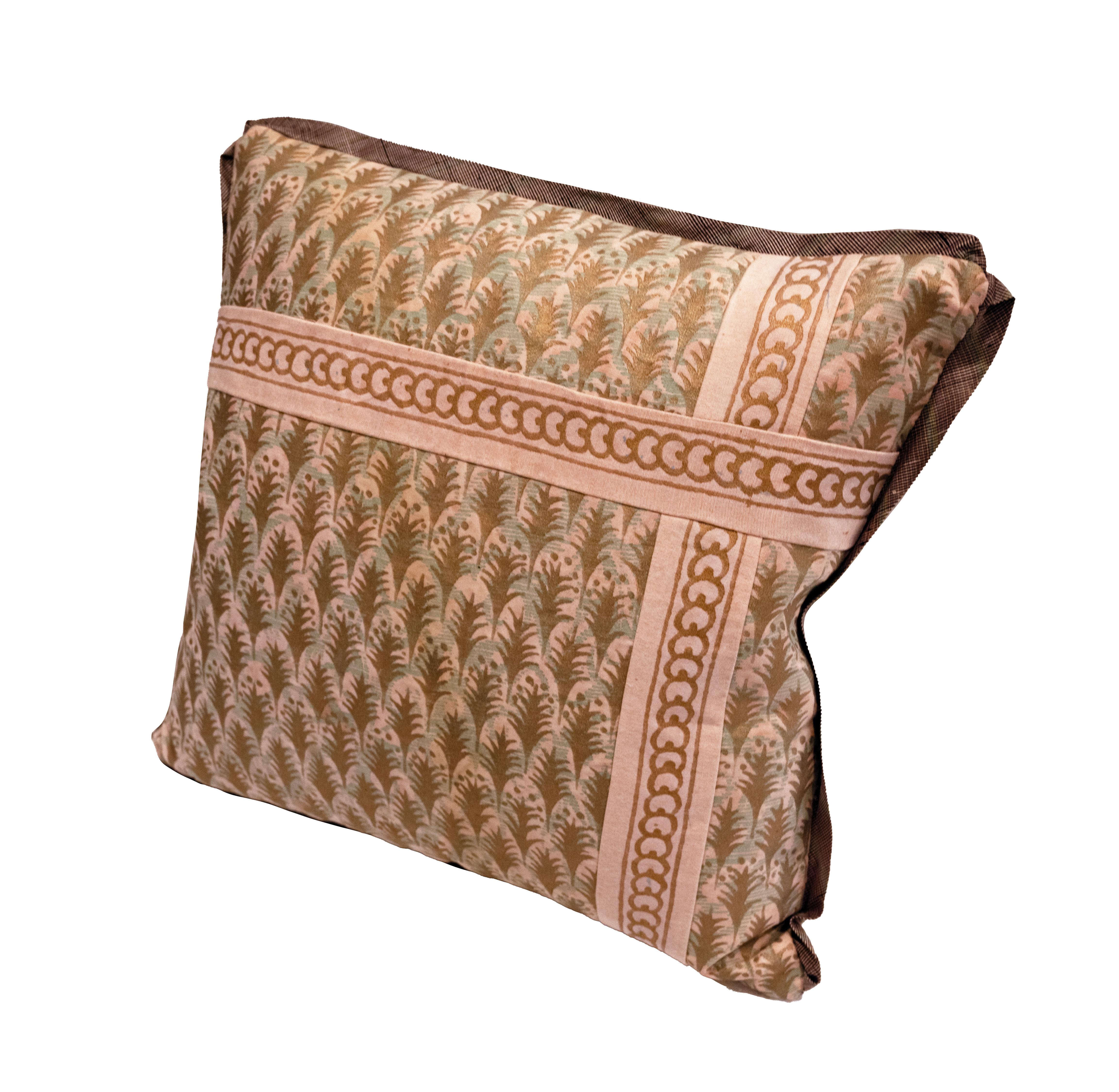 A pair of hand-made Fortuny cushions in the Puimette pattern with applique of the Puimette pattern trim. With silk backs and silk bias edging. Filled with a 50/50 feather and down insert.