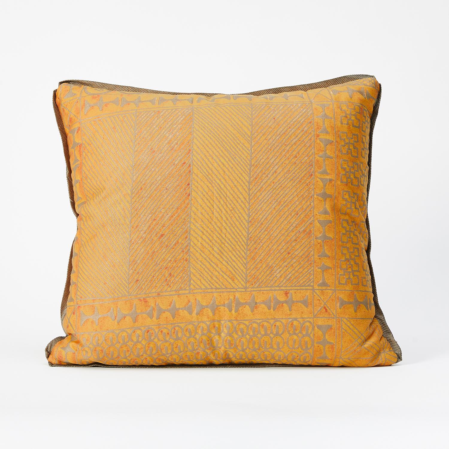 A pair of Fortuny fabric cushions in the Ashanti pattern, gold and silver color way with silk edging. Gold wool fabric with brushed texture backing. The pattern, a Geometric design with African tribal motif. 

50 down/50 feather insert. Newly