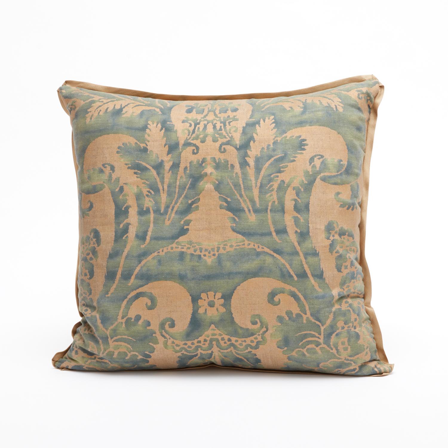 A pair of Fortuny fabric cushions with bias edging and gold silk backing. Featuring a gorgeous blue and gold colorway. The pattern is a 17th century Italian design with wisteria motif.

Newly made using vintage Fortuny fabric. 50 down/50 feather