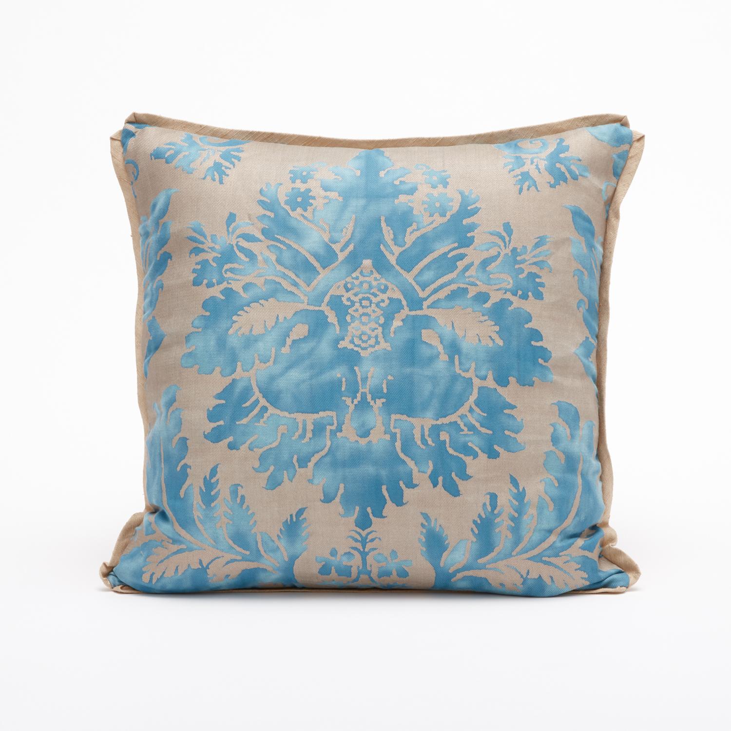 A beautiful pair of Fortuny Fabric cushions in a light blue and gold colorway. Featuring bias edging and matching, light gold backing. The pattern is a 17th century Italian design with wisteria motif. 

Newly made using vintage Fortuny fabric. 50