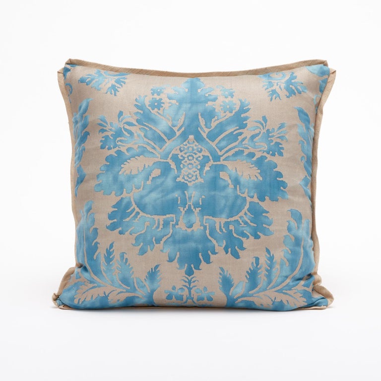 A beautiful pair of Fortuny Fabric cushions in a light blue and gold colorway. Featuring bias edging and matching, light gold backing. The pattern is a 17th century Italian design with wisteria motif. 

Newly made using vintage Fortuny fabric. 50