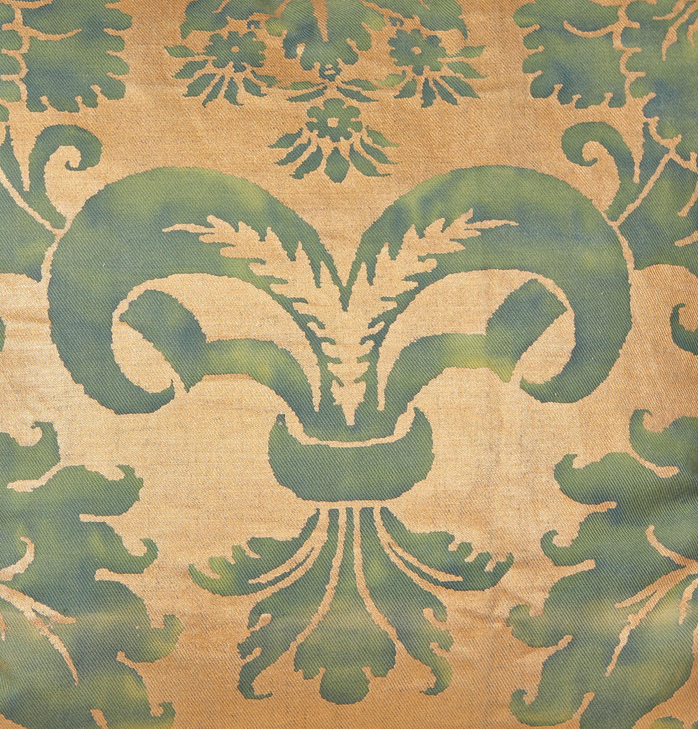 A pair of Fortuny fabric cushions with bias edging and gold silk backing. Featuring a gorgeous blue-green and gold colorway. The pattern is a 17th century Italian design with wisteria motif.

Newly made using vintage unused Fortuny fabric. 50