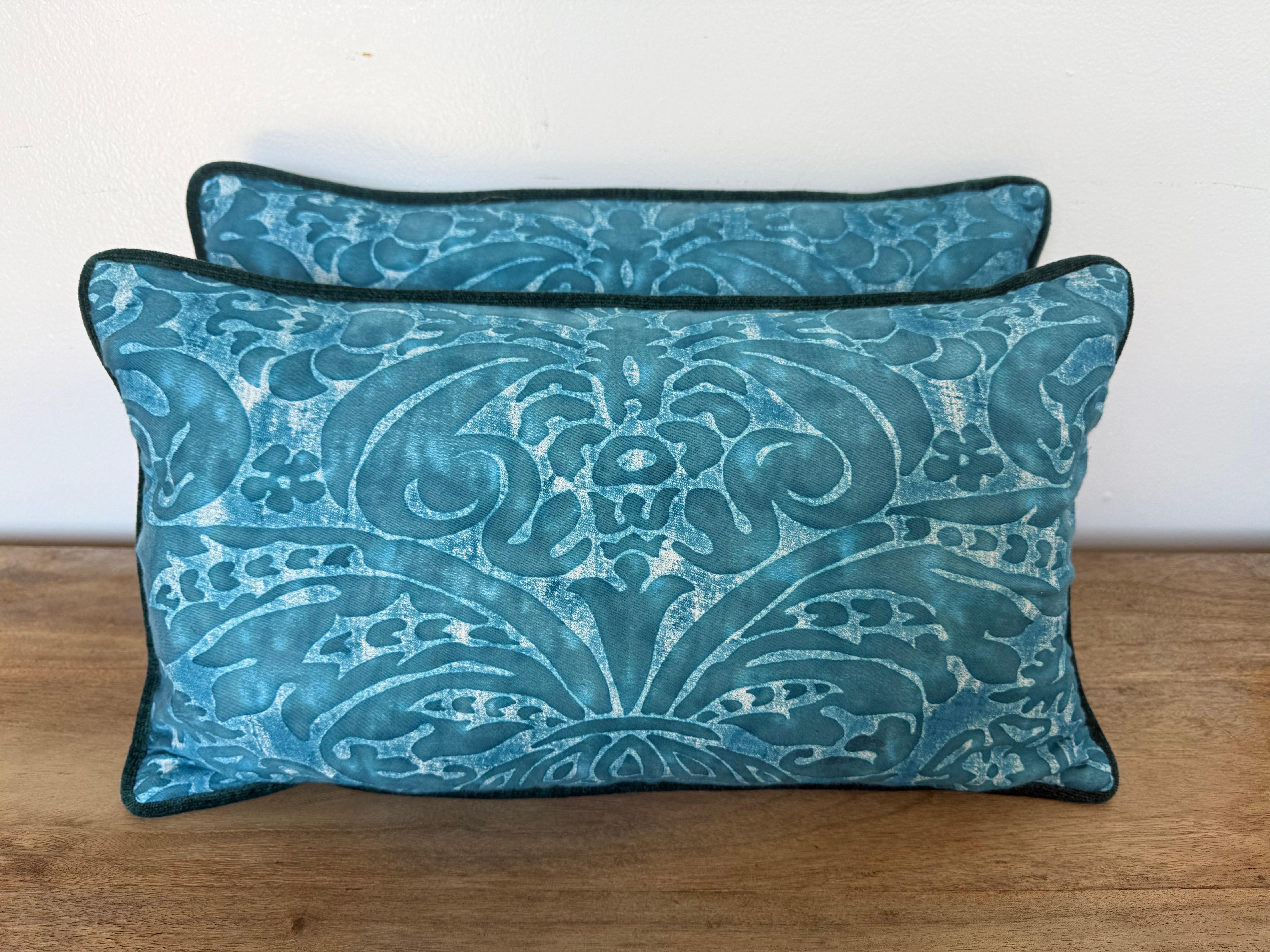 A vibrant pair of custom pillows created by Melissa Levinson, featuring authentic Fortuny hand-printed textile fronts in a striking teal colorway. The bold damask-inspired pattern, with its scrolling acanthus and floral motifs, showcases the