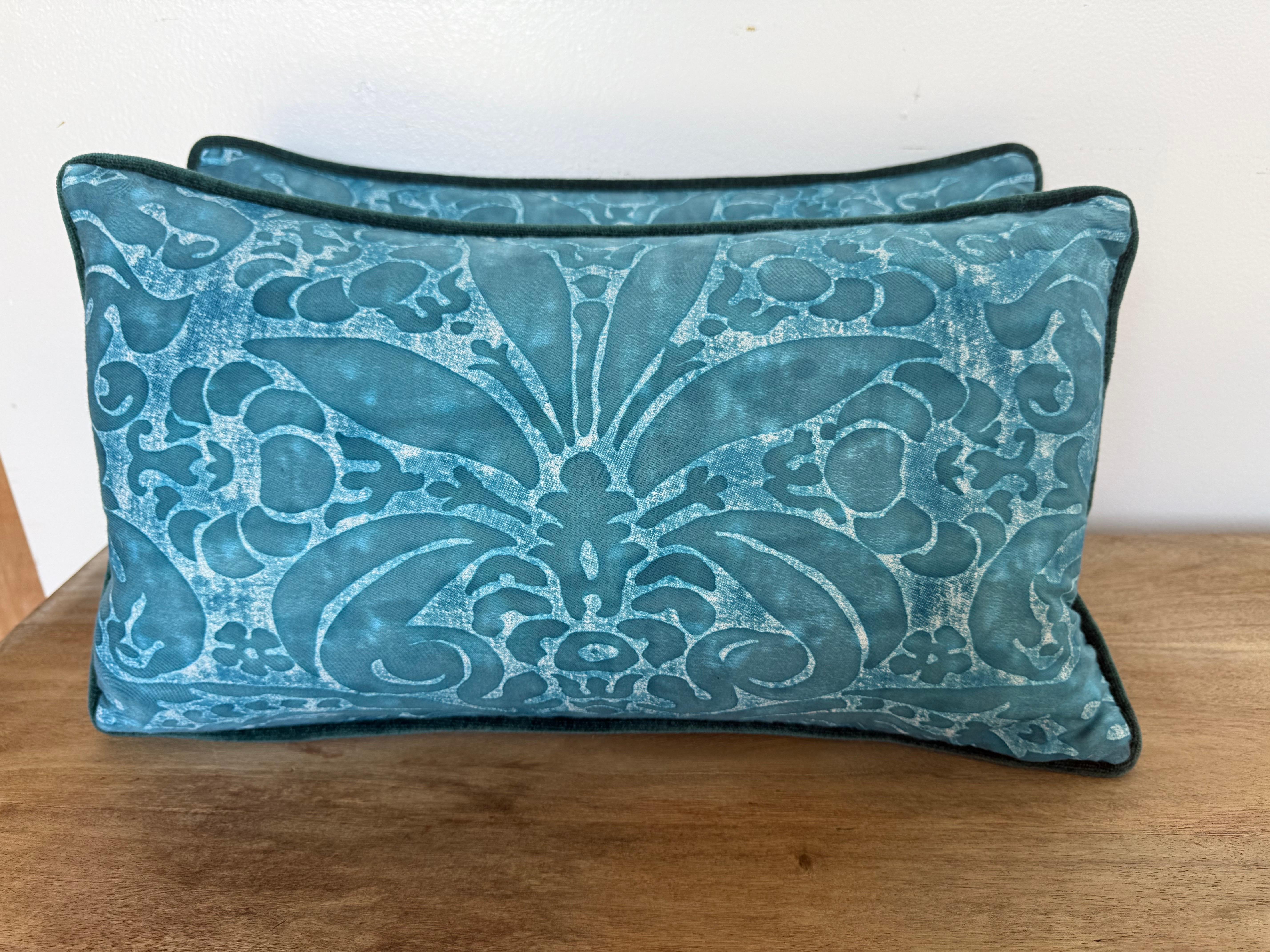 A vibrant pair of custom pillows created by Melissa Levinson, featuring authentic Fortuny hand-printed textile fronts in a striking teal colorway. The bold damask-inspired pattern, with its scrolling acanthus and floral motifs, showcases the