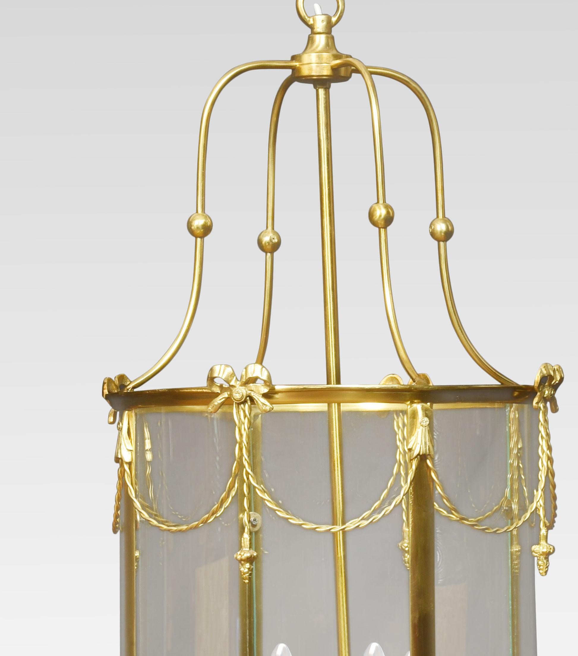 Pair of hall lanterns, the scrolling superstructure above a circular glazed body, with swag and bow decoration. enclosing a four-light electrolier. The lanterns have been rewired.
Dimensions
Height 33 Inches
Width 16.5 Inches
Depth 16.5 Inches.