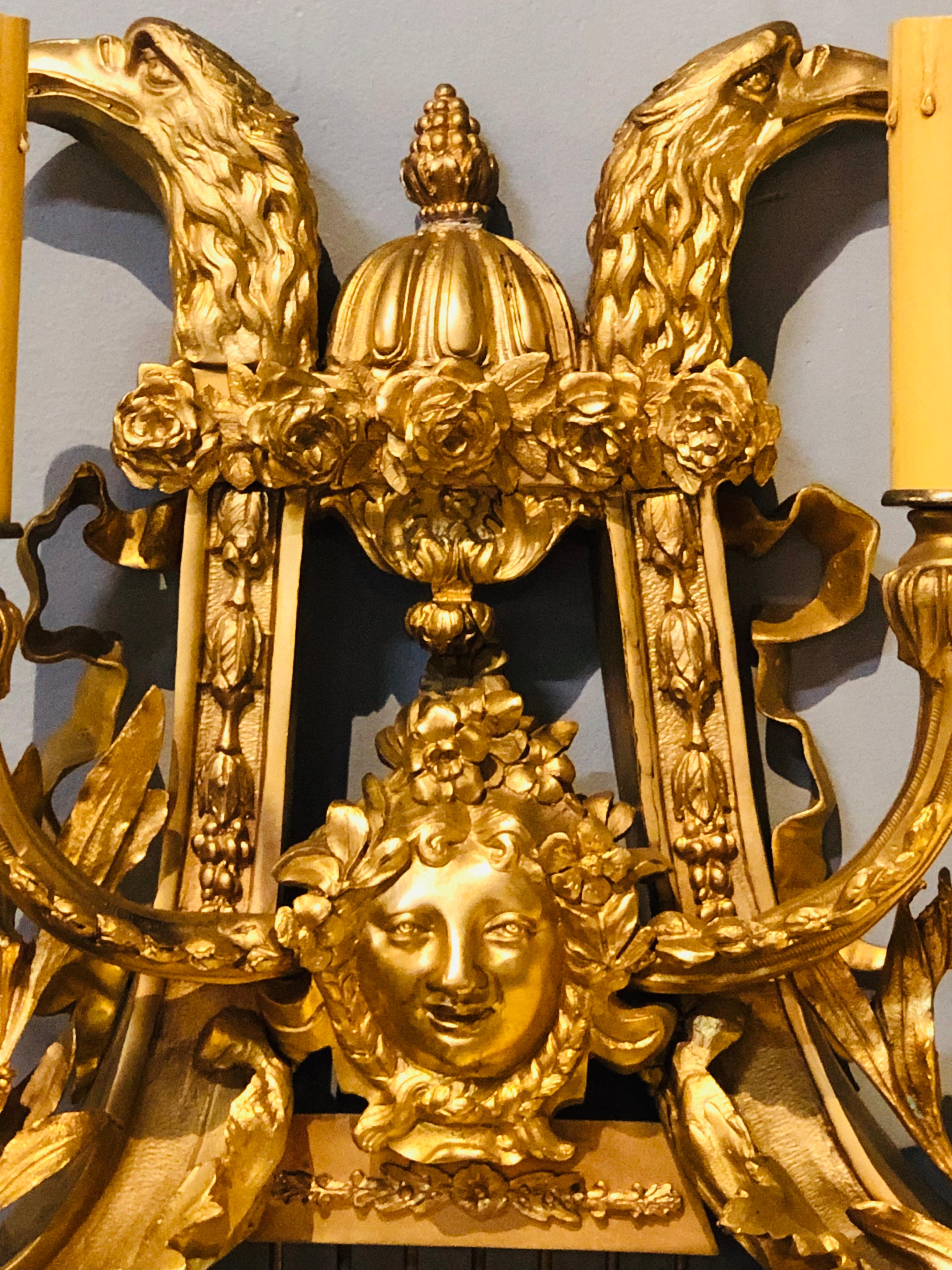 Mid-20th Century Pair of Four-Light Louis XVI Style Bird & Face Mounted Gilt Bronze Wall Sconces