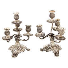 Pair of four-light silver candlesticks