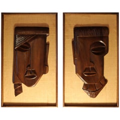 Pair of Framed Carved Brown Rosewood African Faces