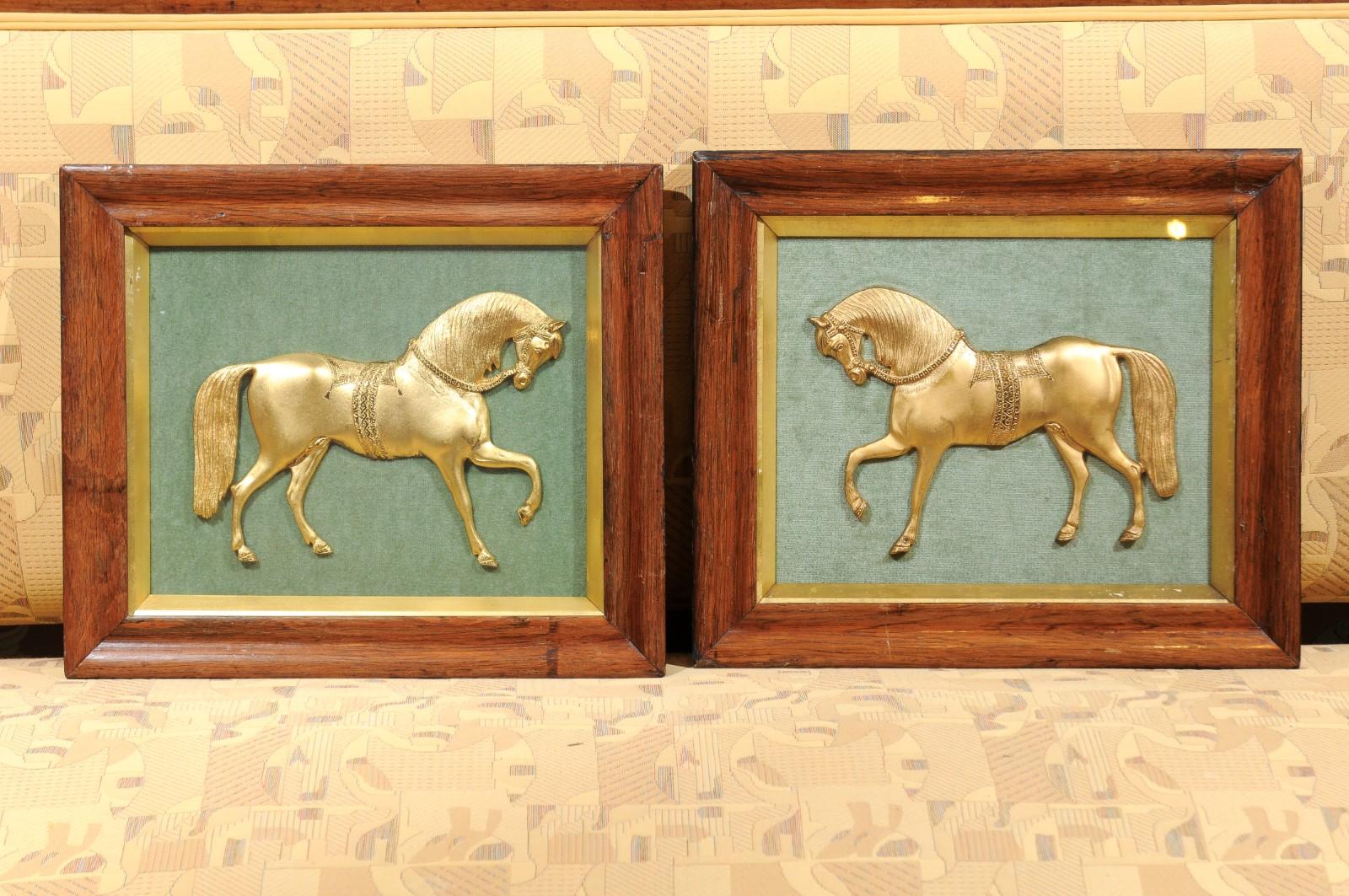 A pair of mid-19th century English gilt bronze horses mounted on green. Velvet in wooden and parcel gilt frames.

 