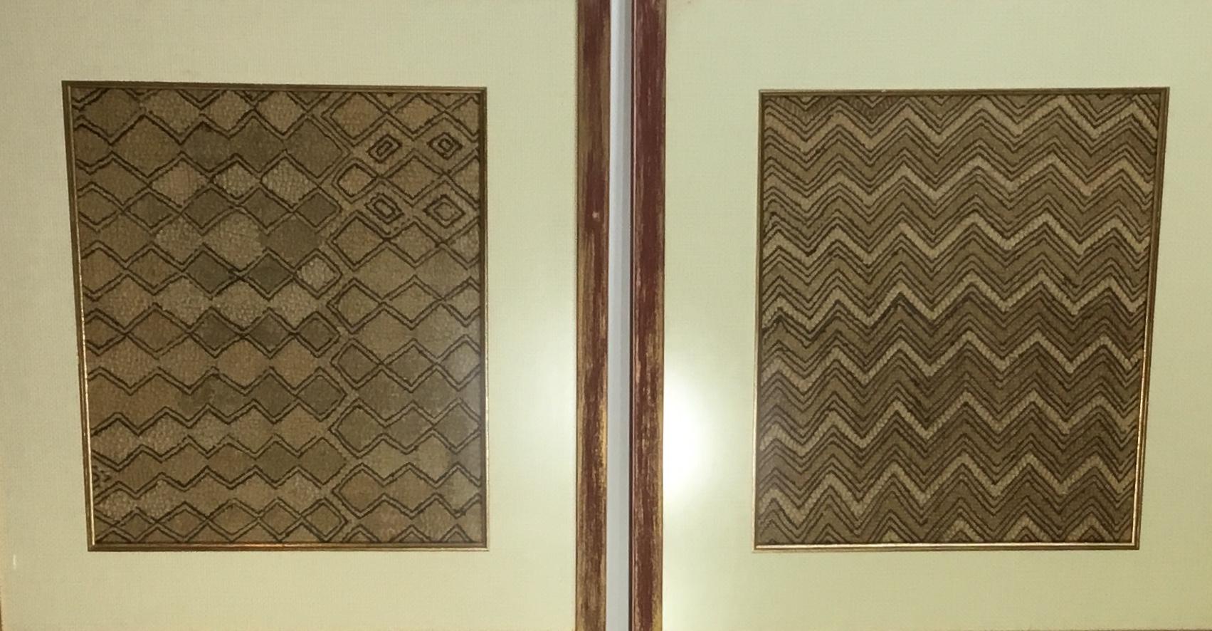 Pair of Kuba cloth from Congo. Woven raffia in traditional geometric pattern. Mounted in a frames with glass for wall hanging. Can be hung horizontally or vertically. Muted soft colors and quality framing.