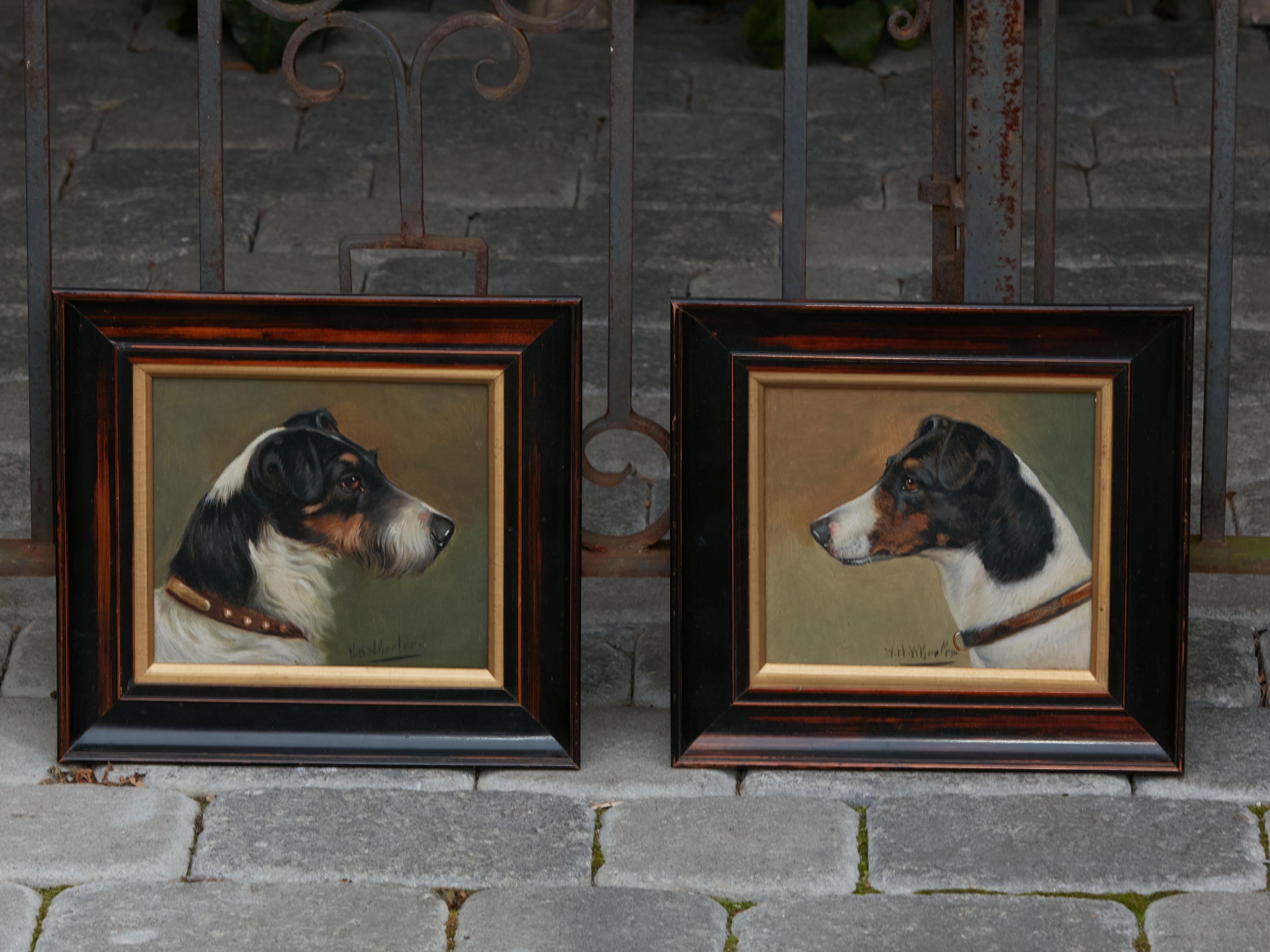 A pair of oil on board small paintings by Walter Herbert Wheeler (1878-1960), depicting terrier dogs in dark frames. Created in England by WH Wheeler at the end of the 19th, early 20th century, each of this pair of small paintings features a terrier