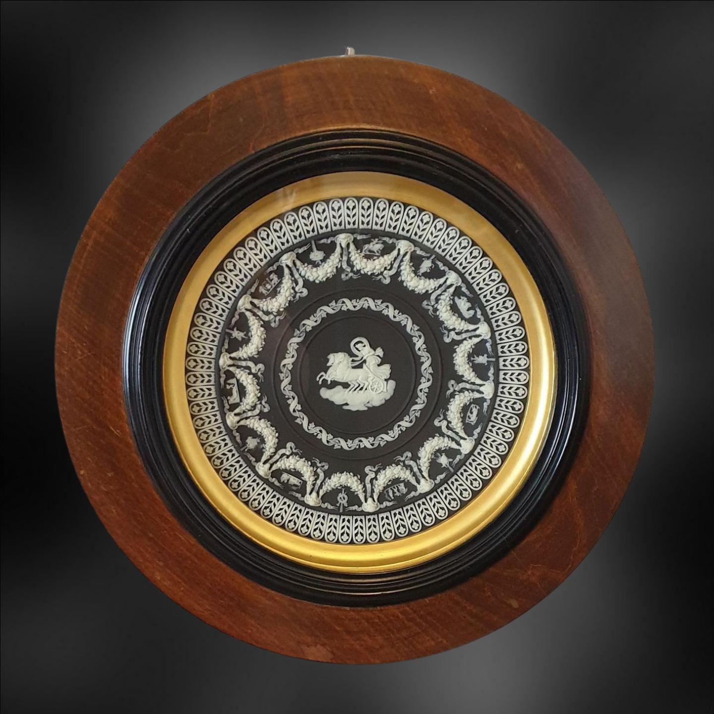 A fine pair of Trophy Plates in black jasperware, decorated with Aurora in her Chariot, and The Muses Watering Pegasus.

Trophy plates were made during the late 19th century and well into the 20th. Each plate has around 2,000 separate reliefs, and