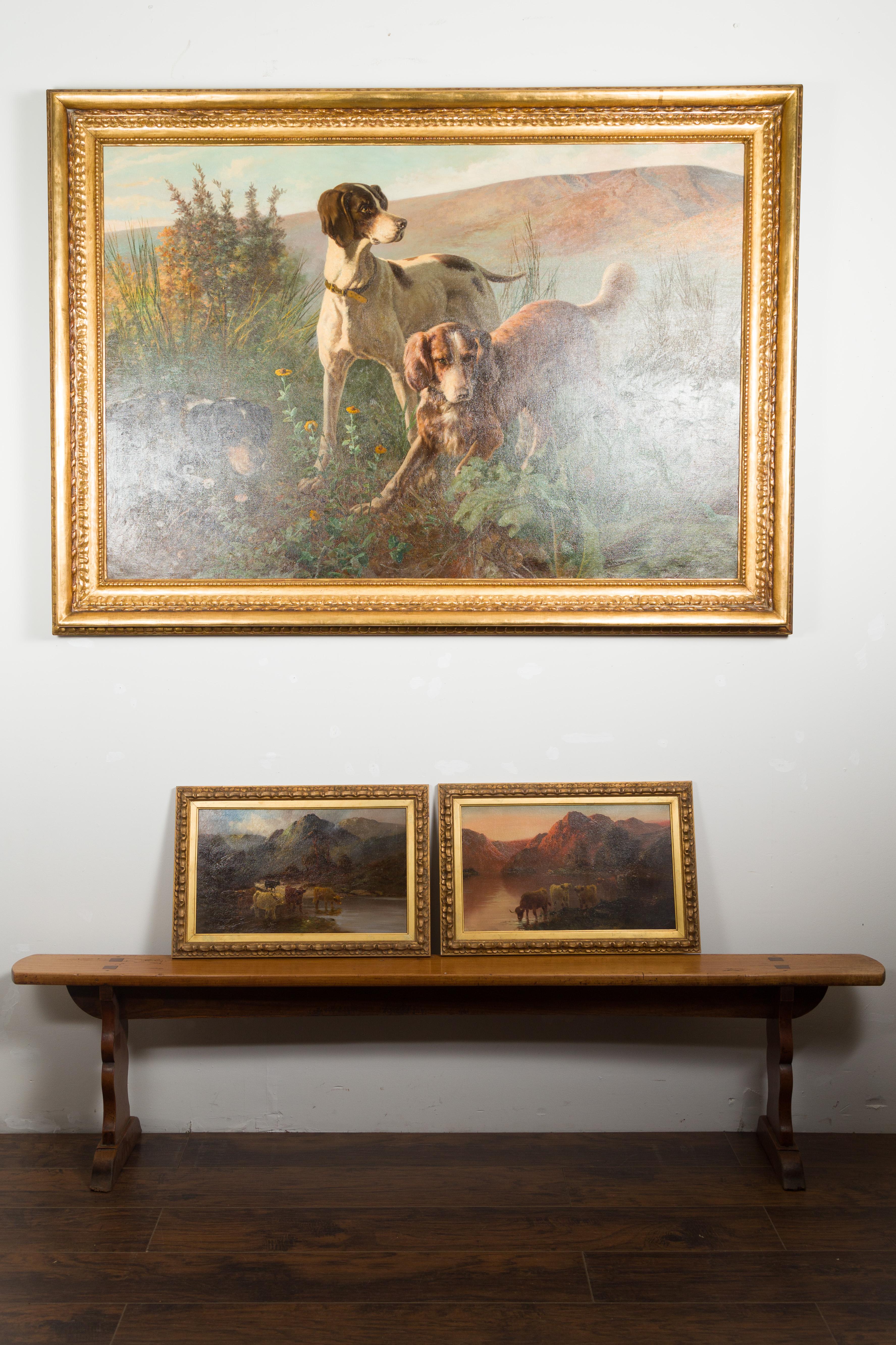 A pair of English oil on canvas paintings by Francis E. Jamieson (1895 - 1950) depicting Scottish Highland cows. Created in England during the first half of the 20th century, each of this pair of oil on canvas paintings depicts a herd of cows