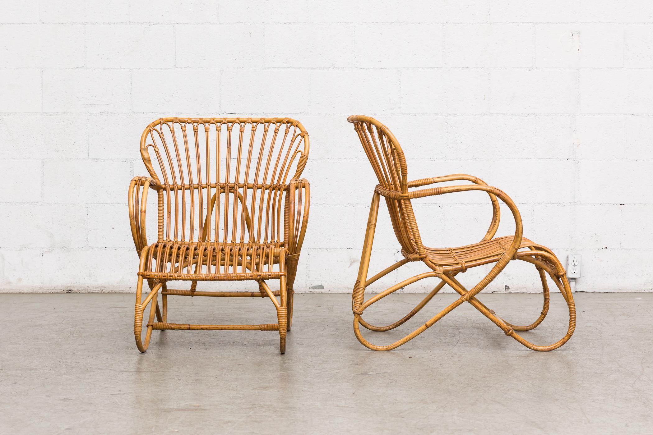 Lovely pair of Franco Albini style bamboo lounge chairs in original condition with minimal bamboo loss. Visible wear Consistent with their age and usage. Set price.
