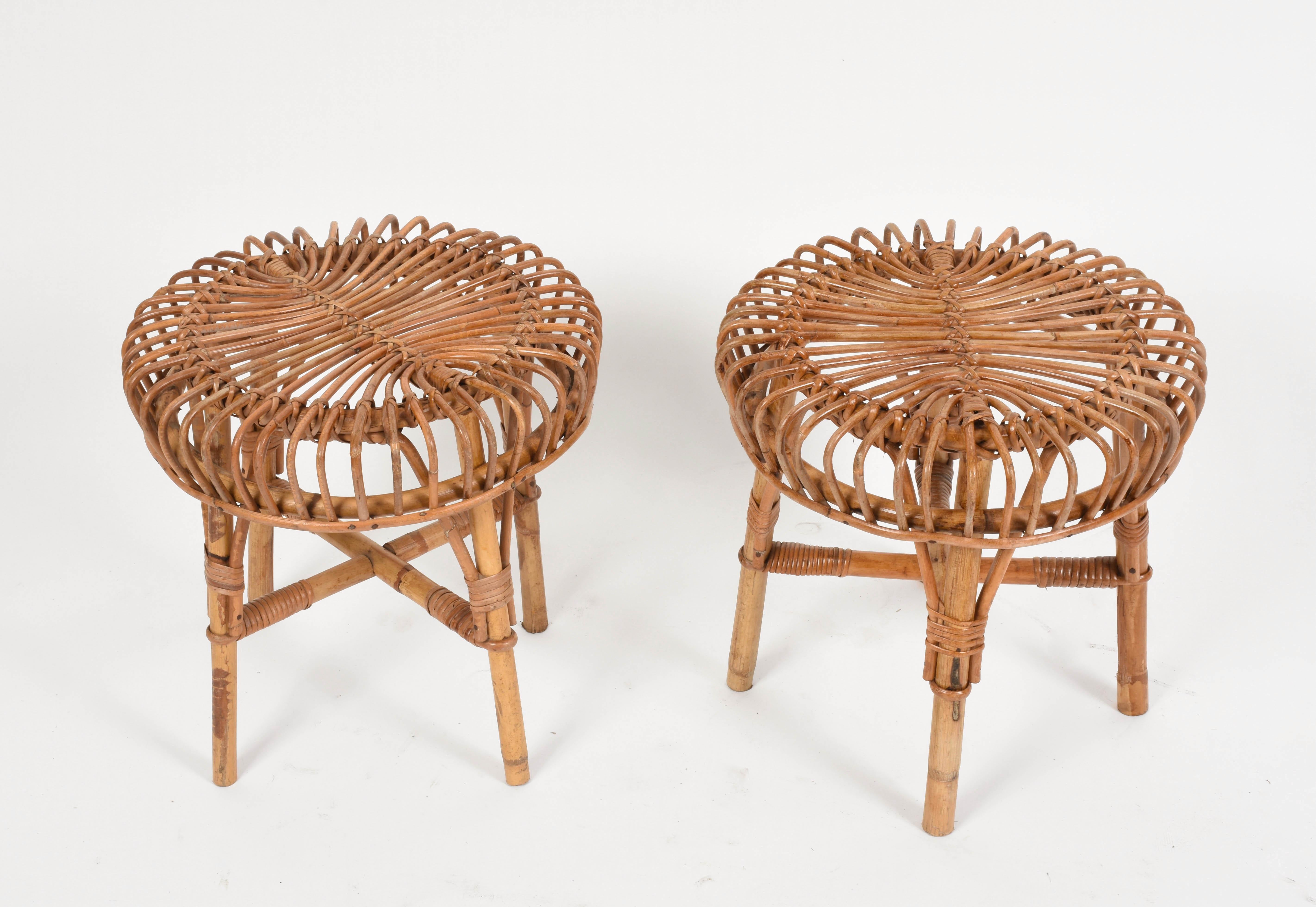 Pair of Midcentury rattan and bamboo stools. These ottomans were designed by Franco Albini in Italy during 1960s.

The extraordinary architectural ideas by Franco Albini emerge in their purity and poetry of form.

A must-have for midcentury