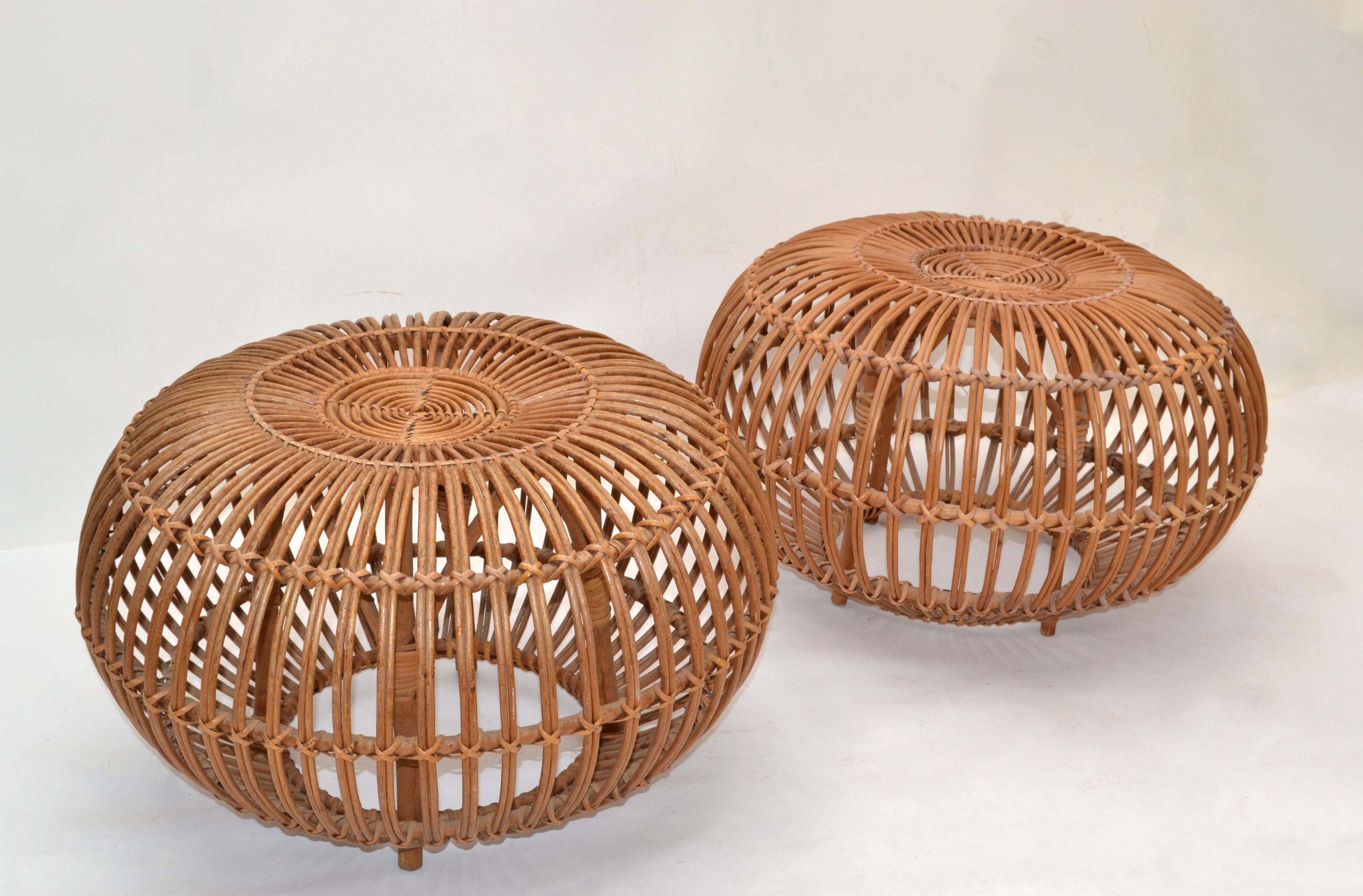 Pair of 1960s vintage style of Franco Albini & Franca Helg round handwoven rattan, wicker ottoman, pouf, footstool or side table.
Exemplary construction, woven ties are firmly linked.
An iconic design Classic made in Italy.
 