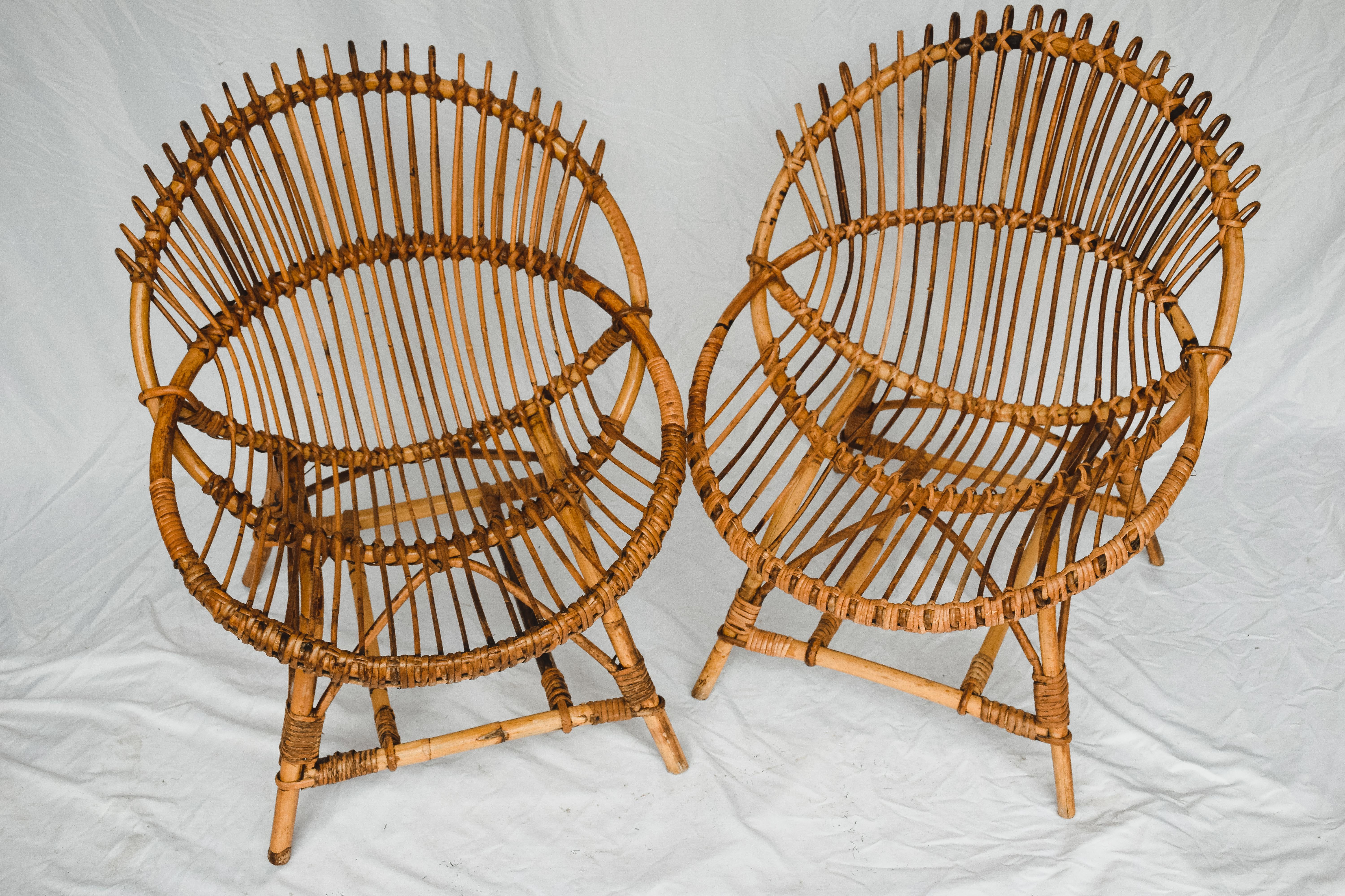 Midcentury Bamboo Franco Albini Style Lounge Chairs. In Original Condition with. Amazing mid century rattan shell-shaped armchair. These pieces were produced in Italy during 1950s and the design is attributed to Franco Albini. The uniqueness of this