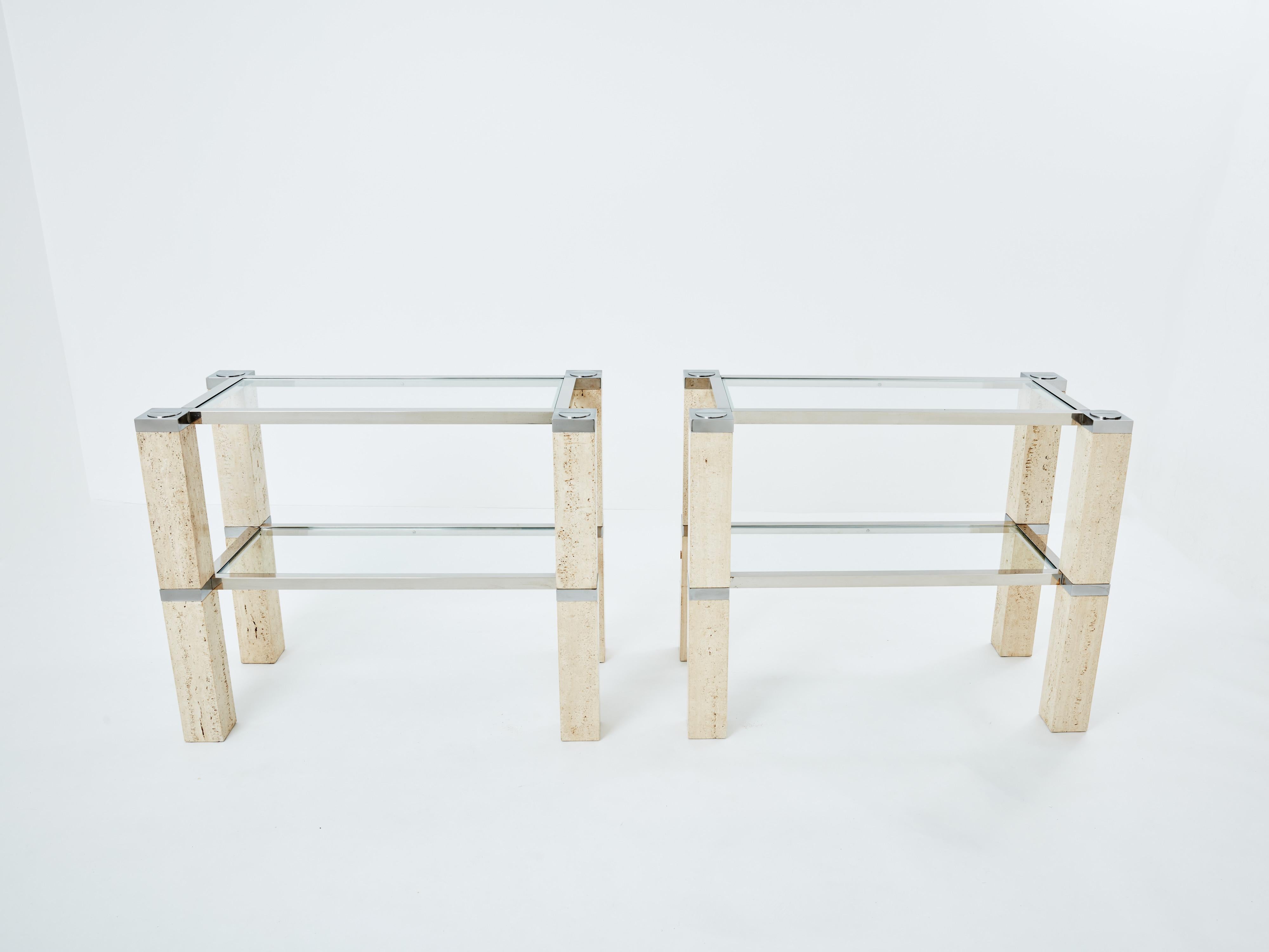 This pair of two-tier console tables was designed by François Catroux and produced by Studio Angeletti in Italy in 1973. Their large square feet are entirely made of travertine pieces, framed by two chrome structures, with a large chrome screw on