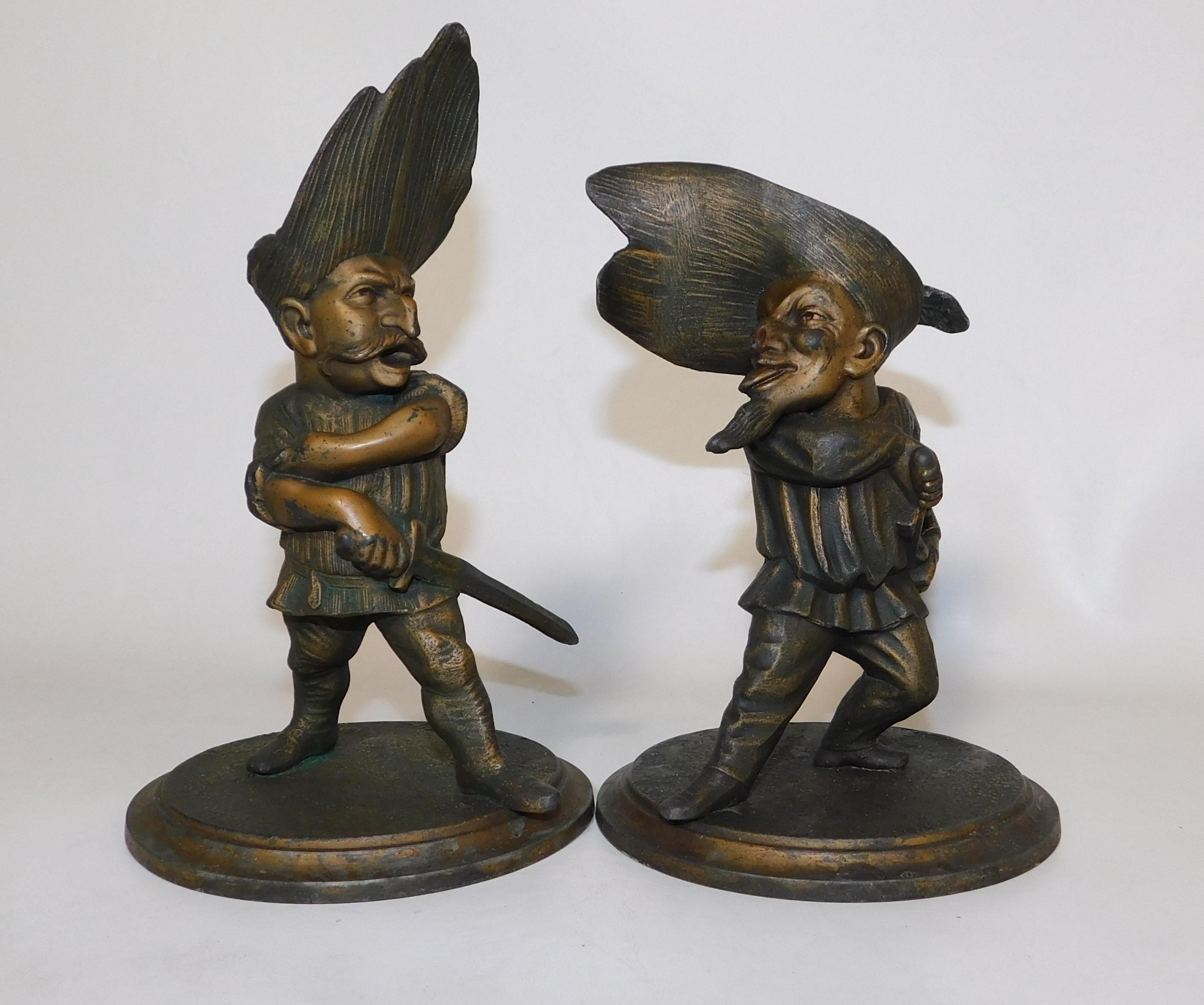 Rare pare of candle holders by French artist Francois George (1807-1873). François George designed a whole series of whimsical cartoon characters which were executed as candle holders often doing self portraits of himself. These two figures are of