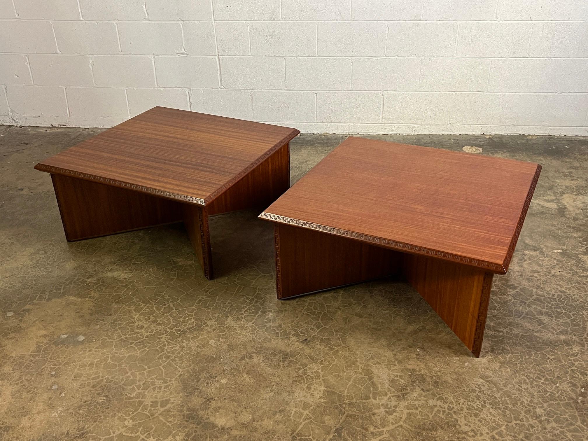 A pair of mahogany tables designed by Frank Lloyd Wright for Henredon.