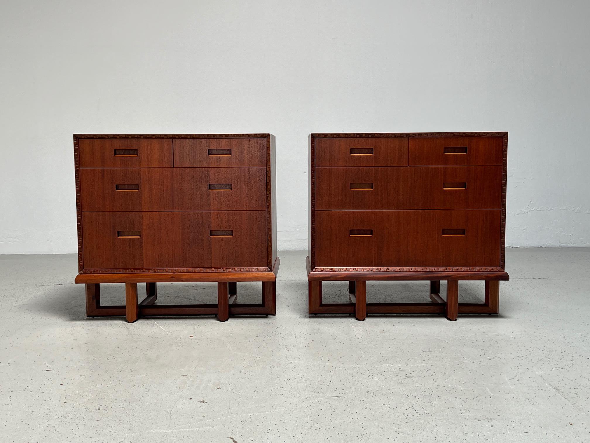 A rare pair of mahogany chests of drawers on stands designed by Frank Lloyd Wright for Henredon.