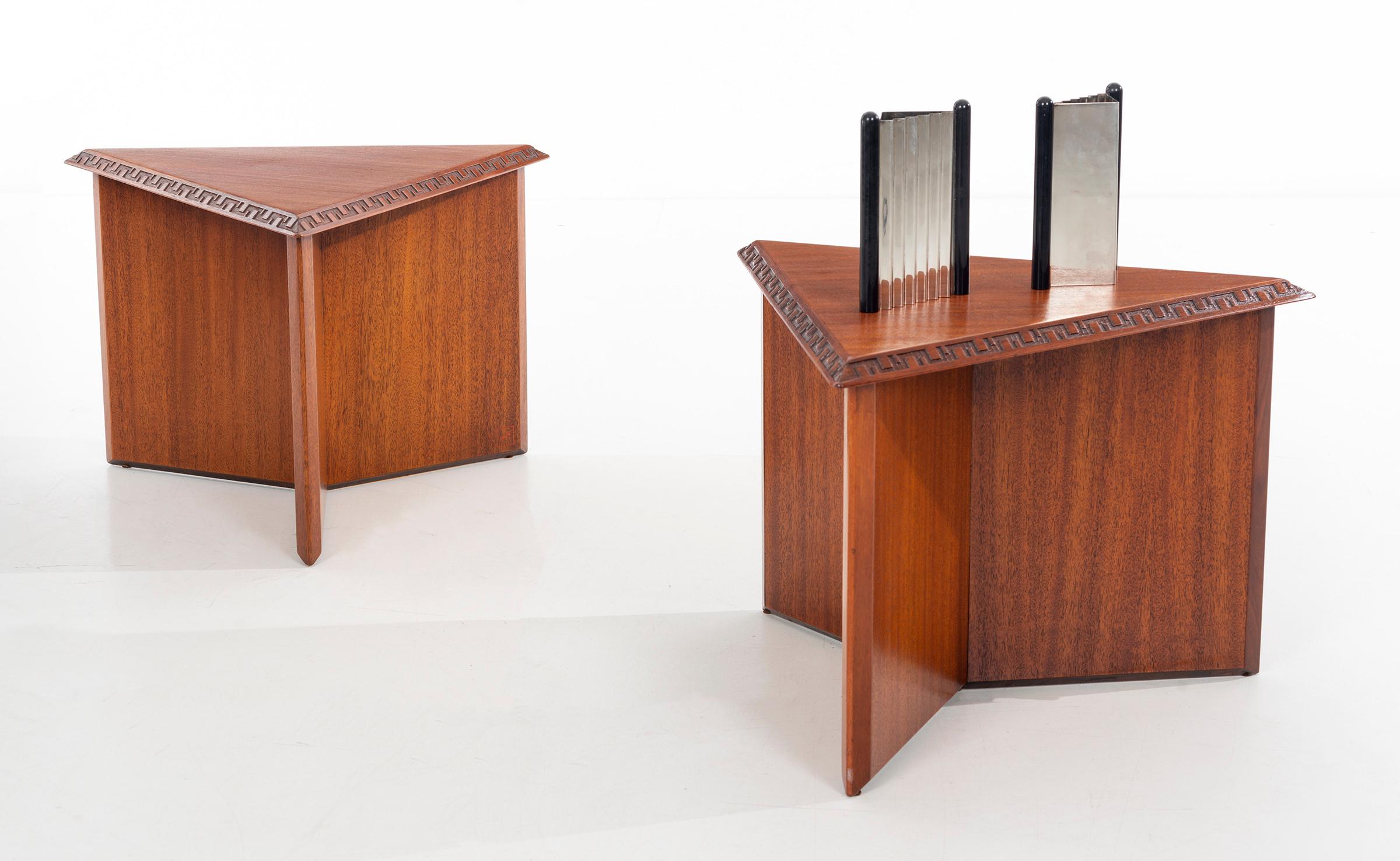 A pair of striking, architectural tables/stools designed by Frank Lloyd Wright for Henredon in 1955. The edges of the triangular tops are carved with Wright's famous Taliesen 