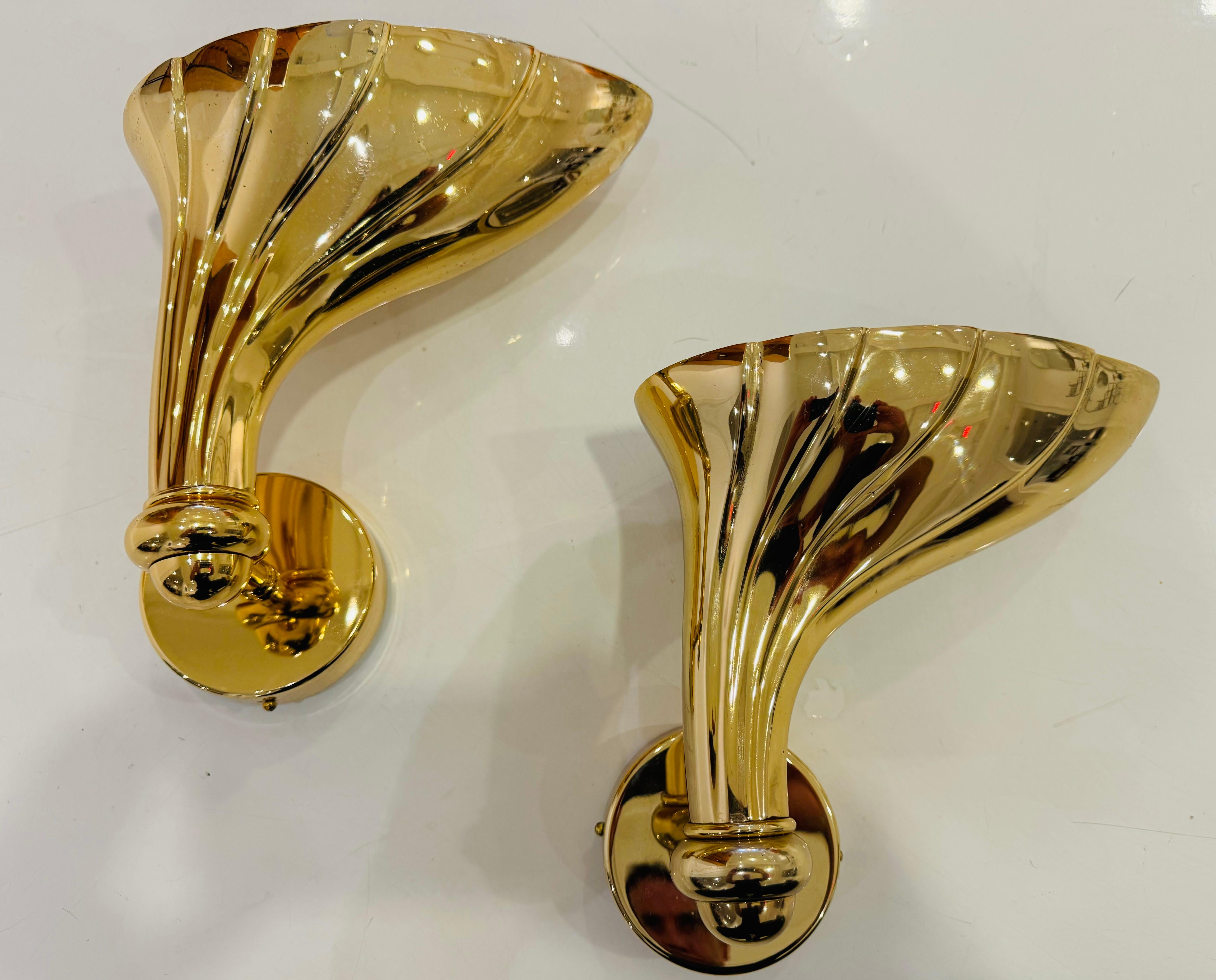 A pair of high quality heavy cast polished bronze floral wall lights by the Italian lighting maker, Fratelli Martini. Newly Rewired. 