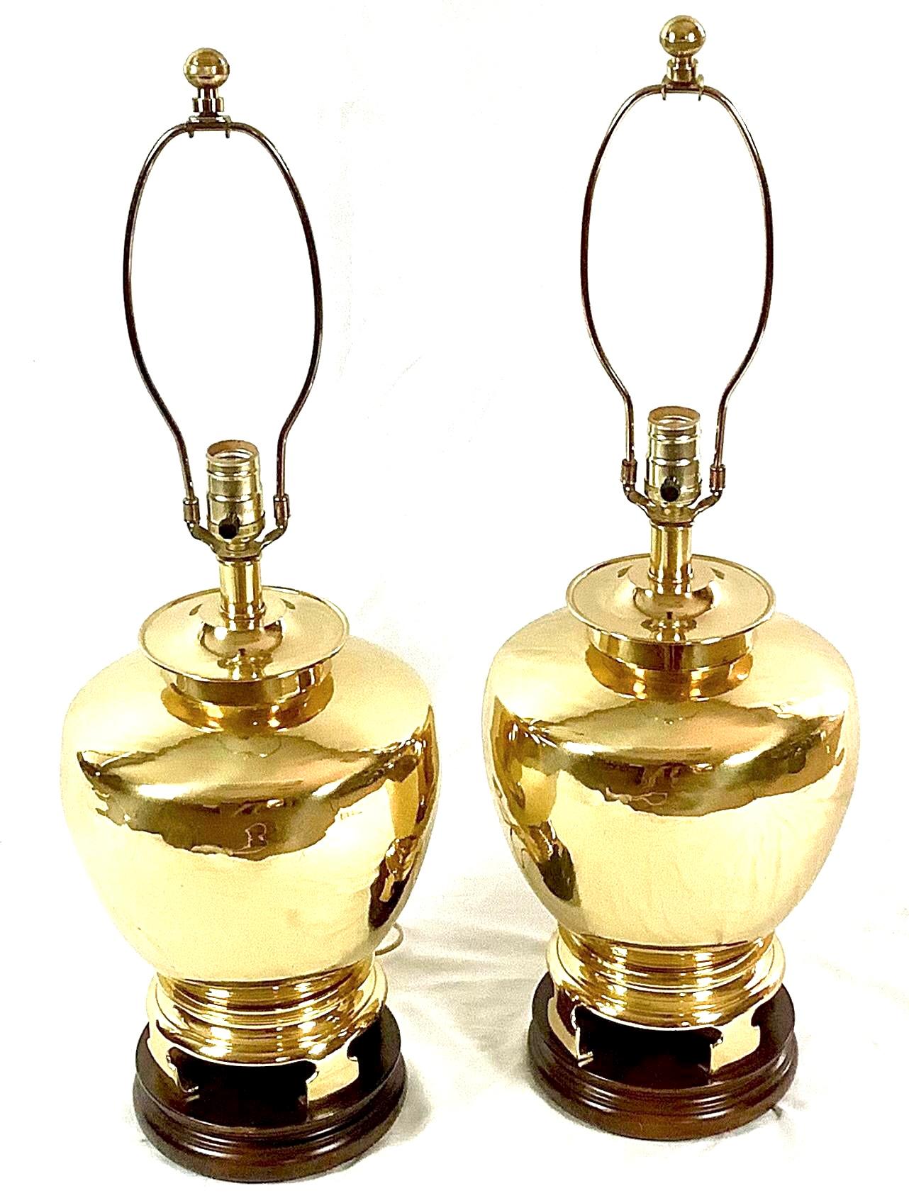 This is a pair of brass Hollywood Regency style Fredrick cooper table lamps in the Chinese manner. They are in the original finish and in working order. Harps and finials included. No shades.