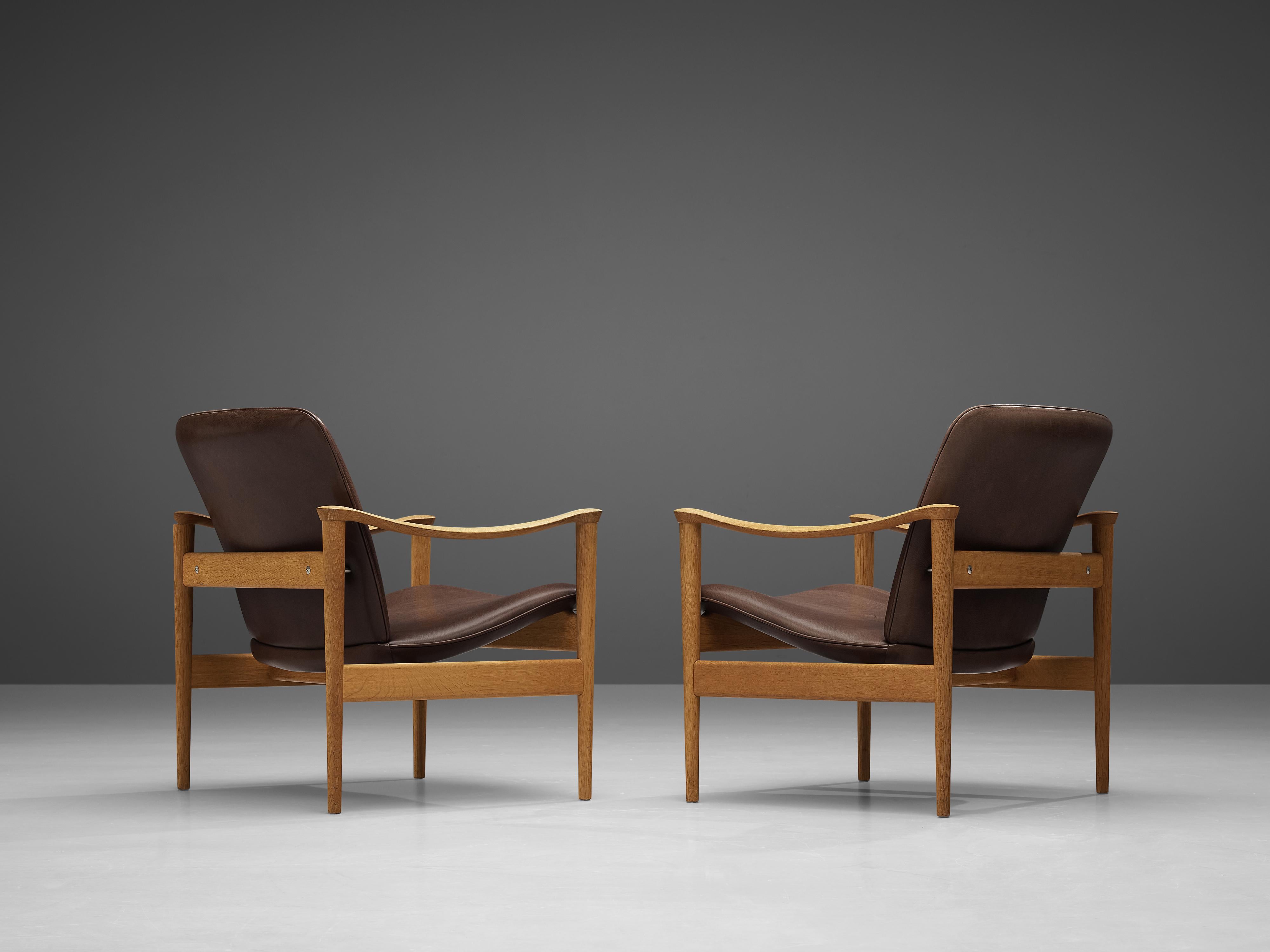 Mid-20th Century Pair of Fredrik A. Kayser Easy Chairs in Oak