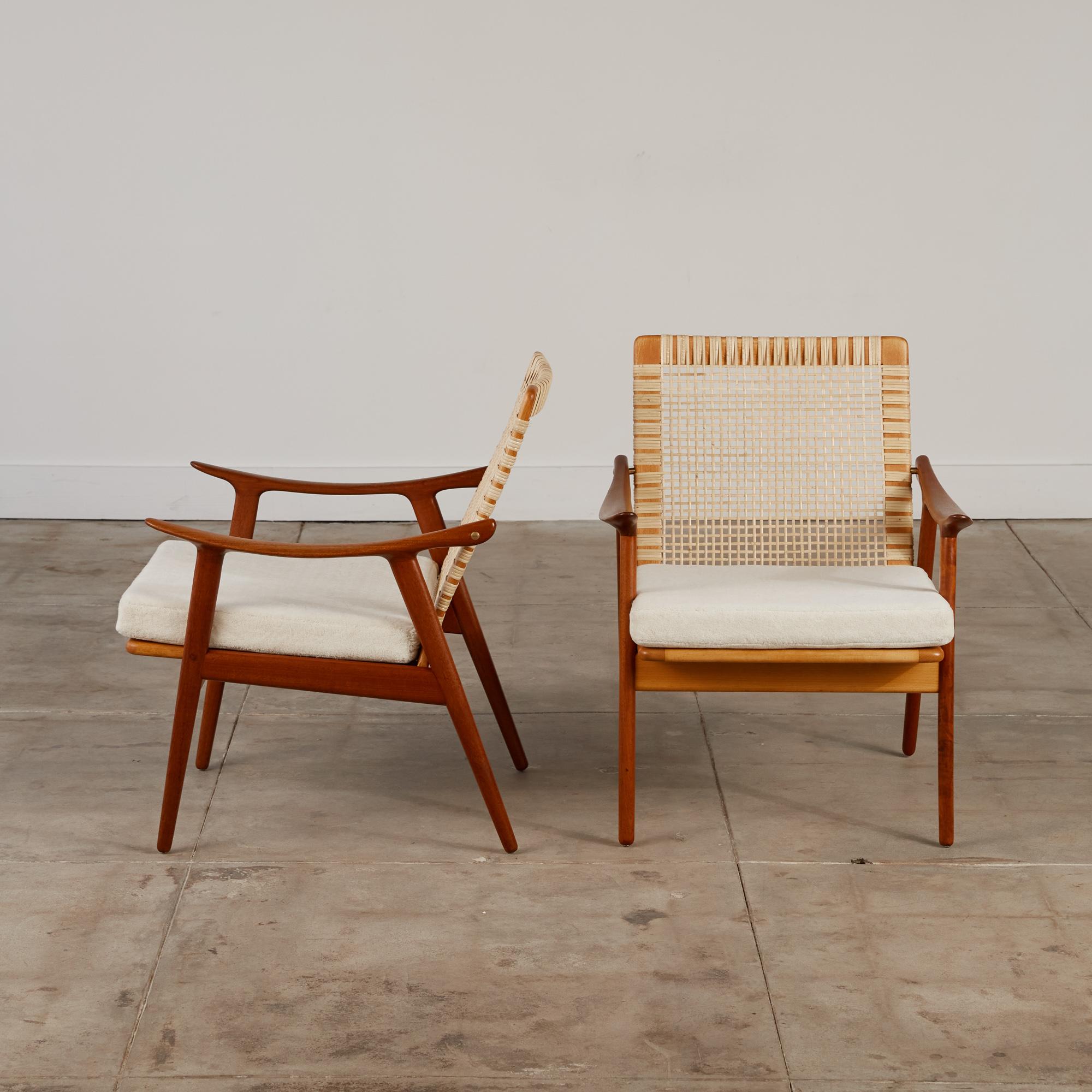 A pair of lounge chairs, designed by Fredrik Kayser for Vatne Mobler and produced in Norway, c.1960s. The frame is made of newly refinished teak and with an oak seat, and newly woven caned backs in great condition, and finished with high pile alpaca