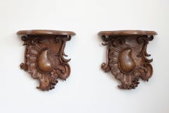 Pair of French 1760s Louis XV Period Walnut Wall Brackets with Rocailles Motifs