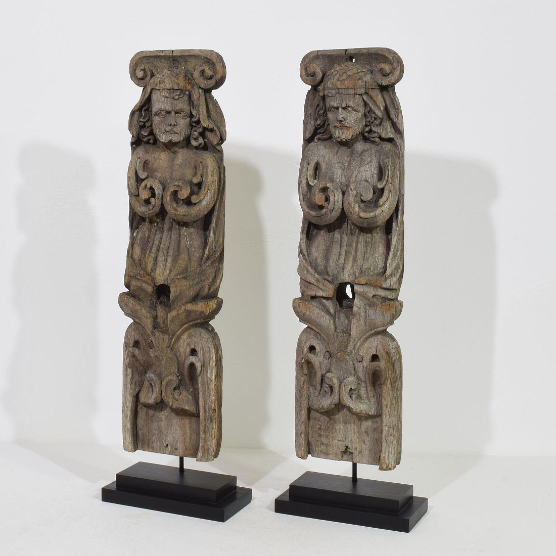 Beautiful weathered oak Renaissance ornaments that most likely once adorned a half timbered house in Normandy.
France, 17th century. Weathered, small losses

Measurement here below are individual and  include the wooden pedestals.