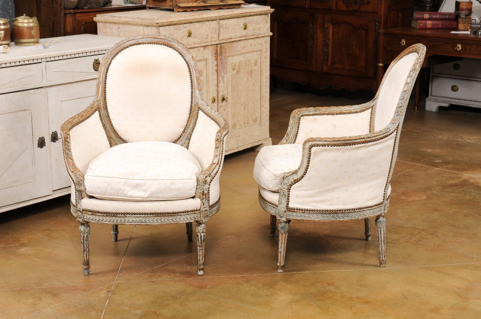 Pair of French 1850s Louis XVI Style Painted Bergère Chairs with Carved Décor 7