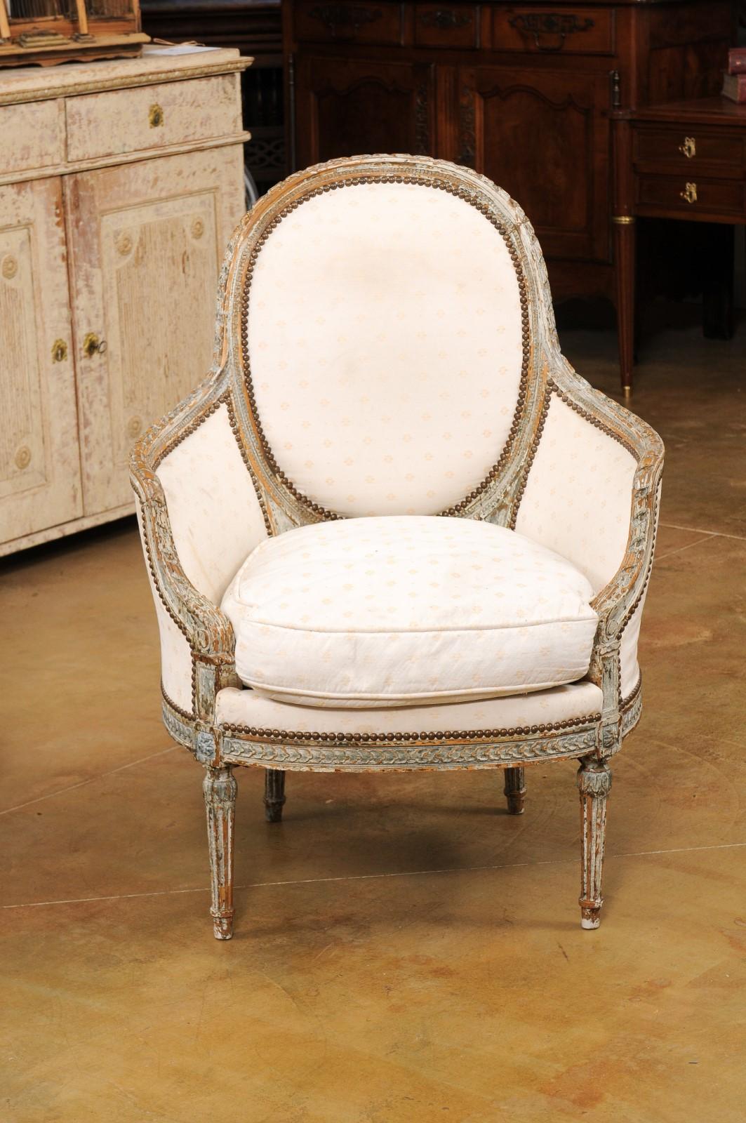 19th Century Pair of French 1850s Louis XVI Style Painted Bergère Chairs with Carved Décor