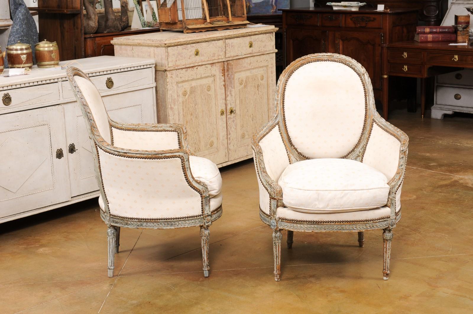 Upholstery Pair of French 1850s Louis XVI Style Painted Bergère Chairs with Carved Décor