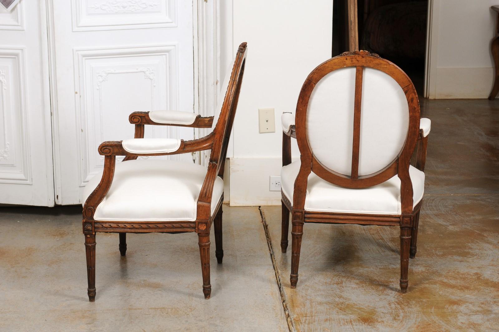 Pair of French 1850s Louis XVI Style Walnut Oval Back Upholstered Armchairs For Sale 3