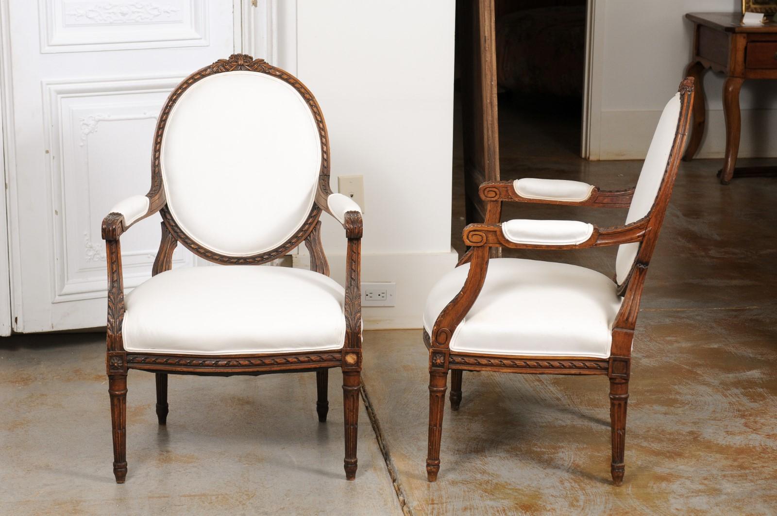 Pair of French 1850s Louis XVI Style Walnut Oval Back Upholstered Armchairs For Sale 4