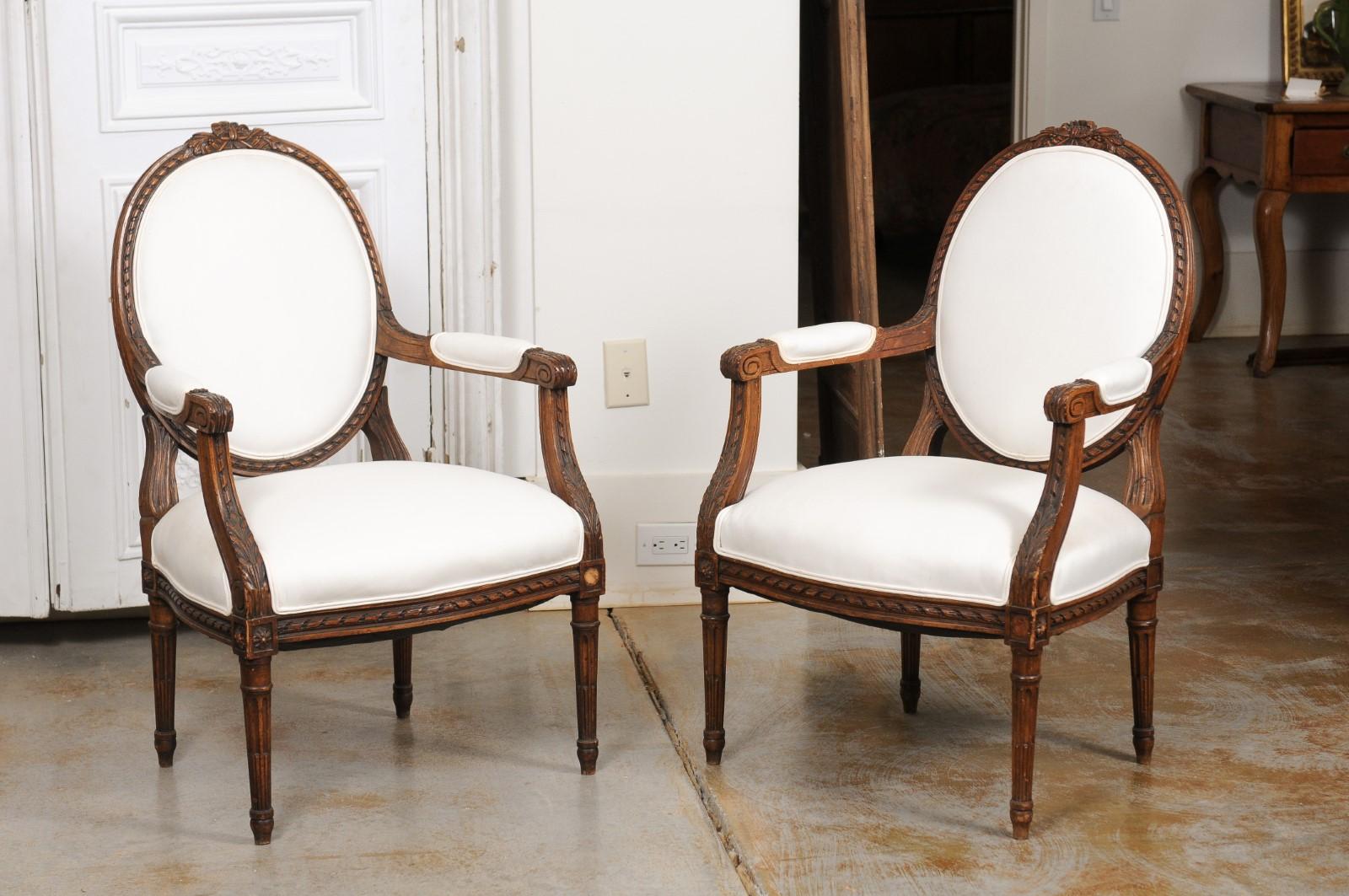 Pair of French 1850s Louis XVI Style Walnut Oval Back Upholstered Armchairs For Sale 6