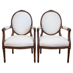 Pair of French 1850s Louis XVI Style Walnut Oval Back Upholstered Armchairs Pair of French 1850s Louis XVI Style Walnut Oval Back Upholstered Armchairs