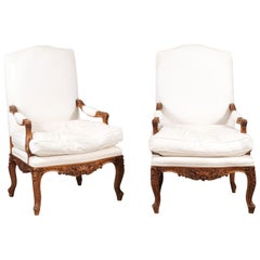 Pair of French 1850s Régence Style Fauteuils with Carved Shells and Upholstery